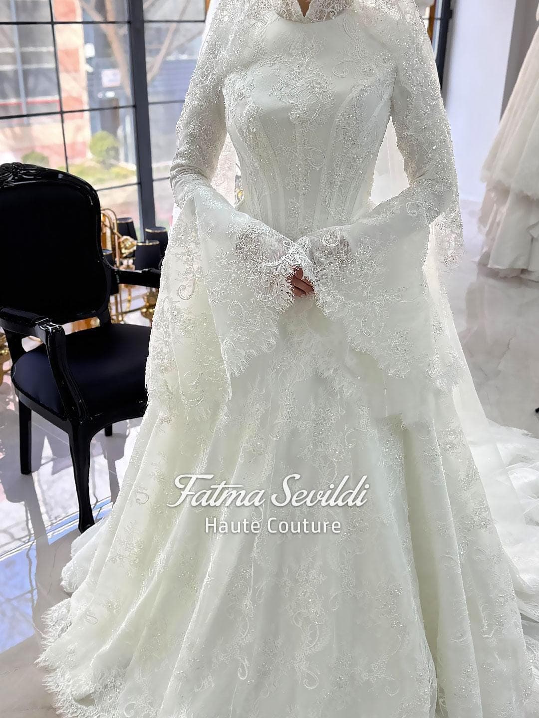 Veiled hijab wedding dress with corset bodice, bell sleeves, and beaded lace in an elegant A-line silhouette. Premium lace veil included for a complete modest bridal set.