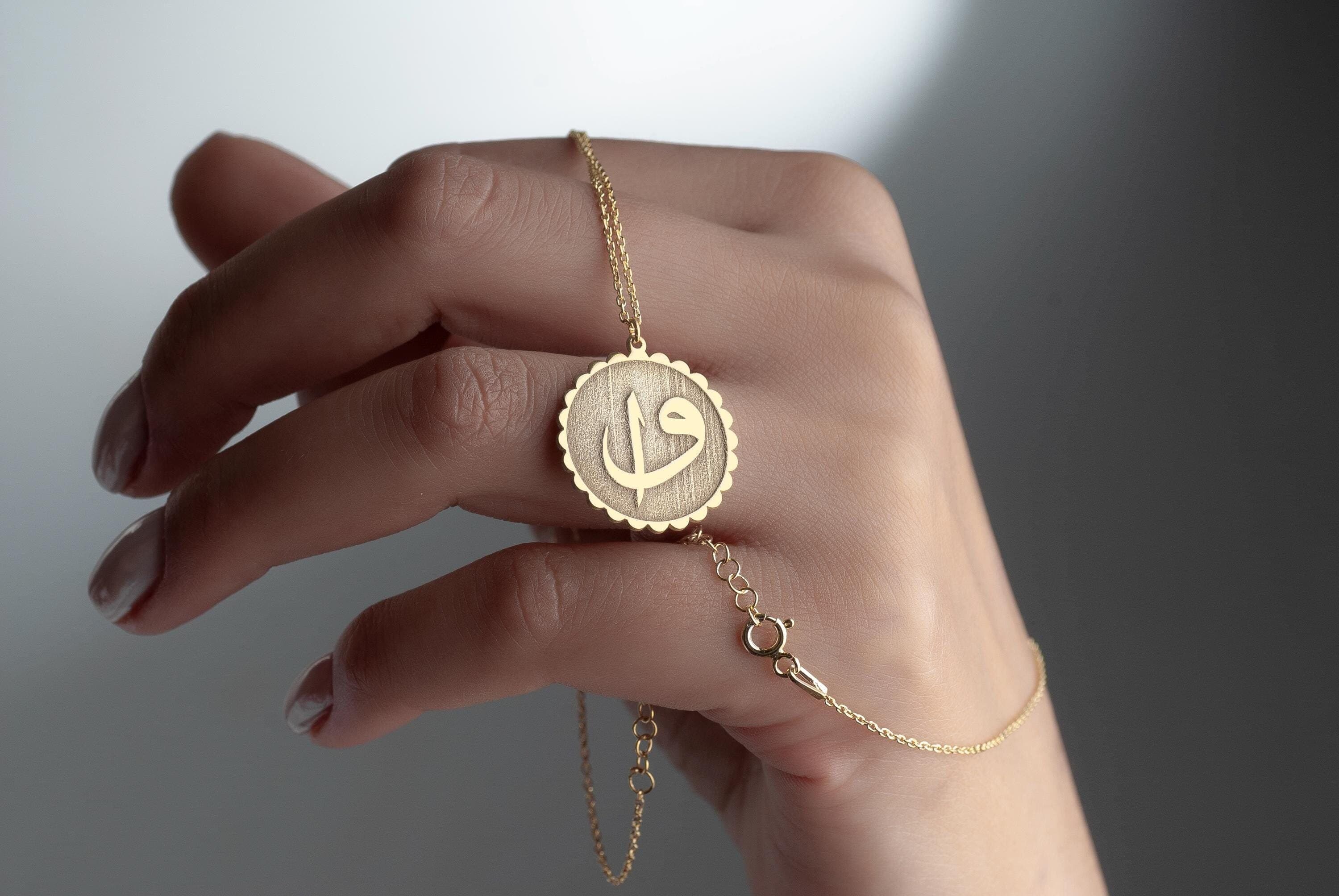 Gift Shop Islamic
Arabic Letter Islamic Necklace
Elif and Vaw Arabic letter written Necklace can be worn every day. It is made by hand in our workshop with care. All our jewelry is the most elegant choice for the bridesmaids, friends, your loved ones and for yourself. It is also a fact that silver jewelry improves blood circulation and provides electricity and makes you feel awake. 
Elif Vaw Round Necklace; Truth Muslim Symbol, 925 Sterling Silver, Modest