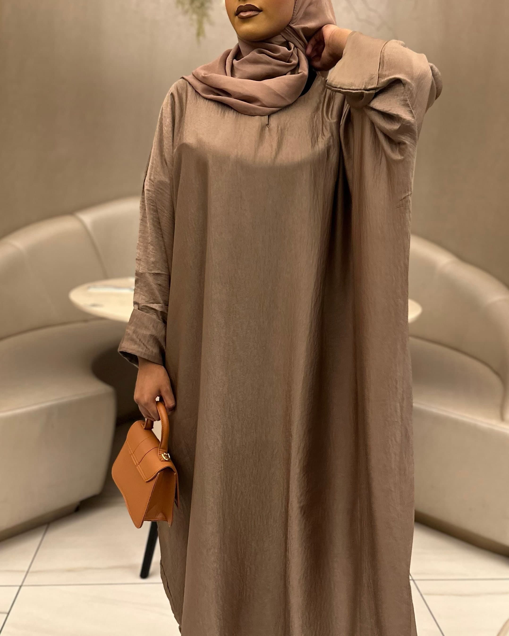 Women’s chocolate brown abaya, soft flowy fabric, relaxed fit for modest and umrah wear.