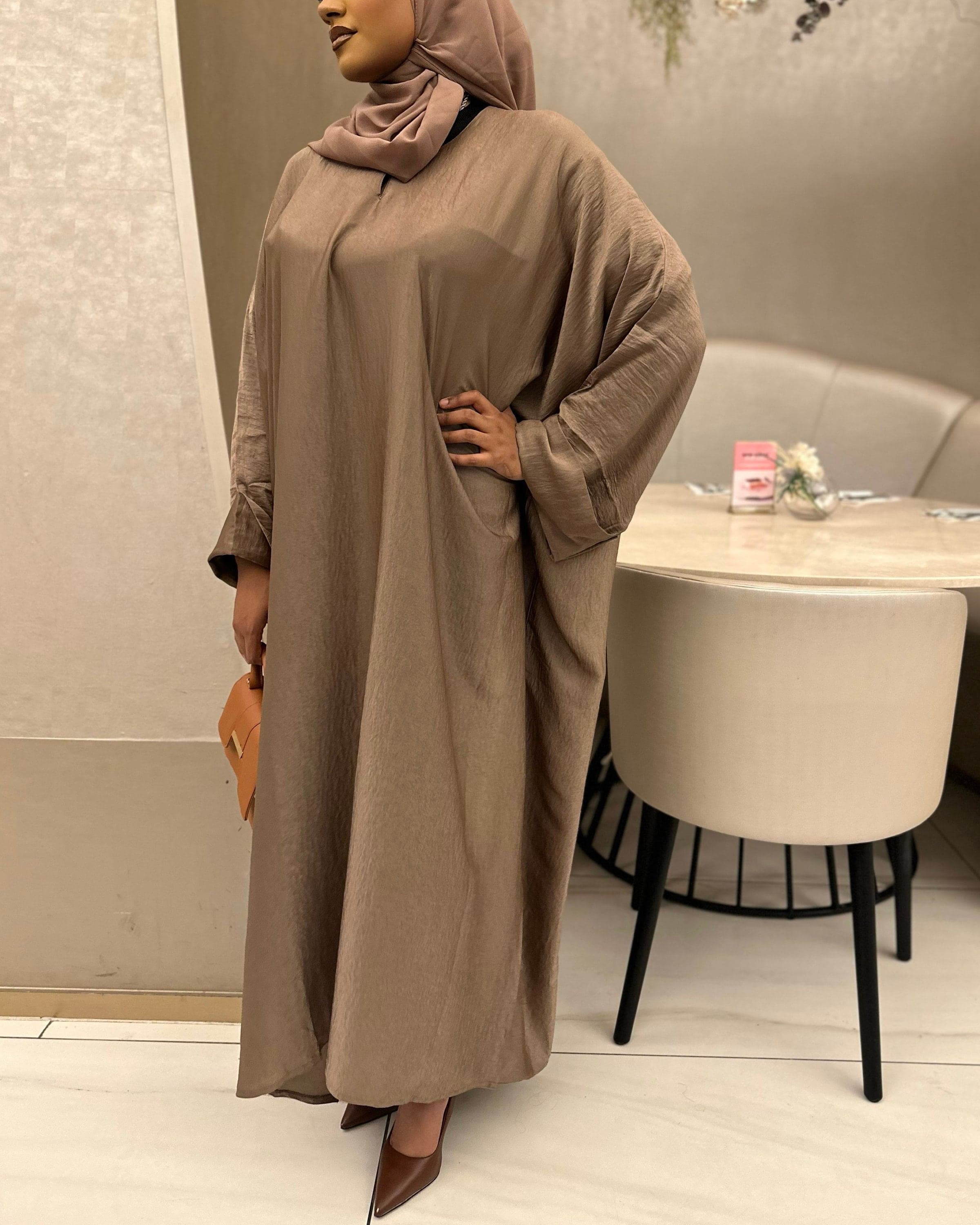 Full-length chocolate abaya for women, lightweight and breathable, ideal for umrah and modest wear.