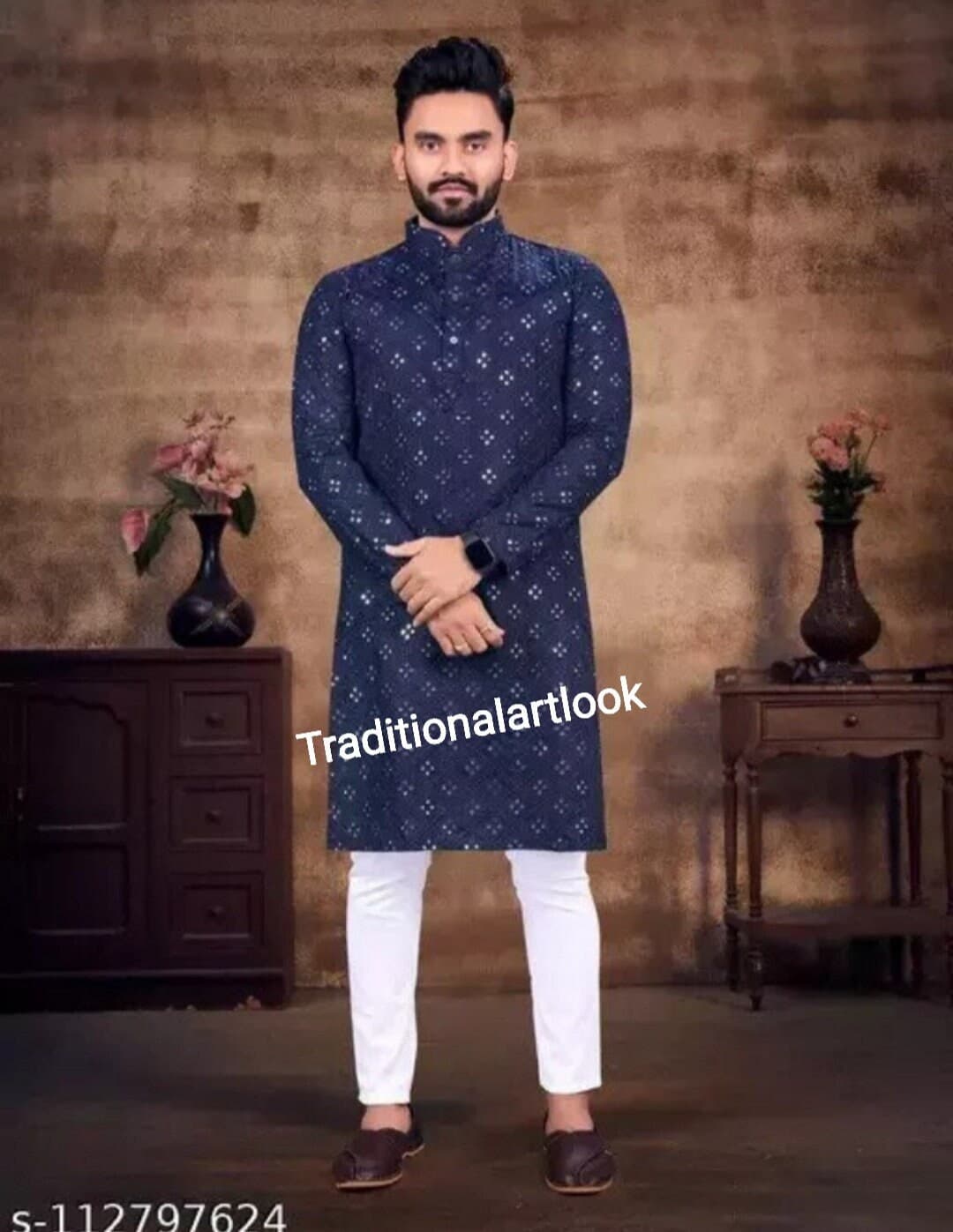 May include: A man is wearing a navy blue long-sleeved kurta with a white pattern. He is wearing white pants and brown shoes. The text "Traditionalartlook" is visible on the image.