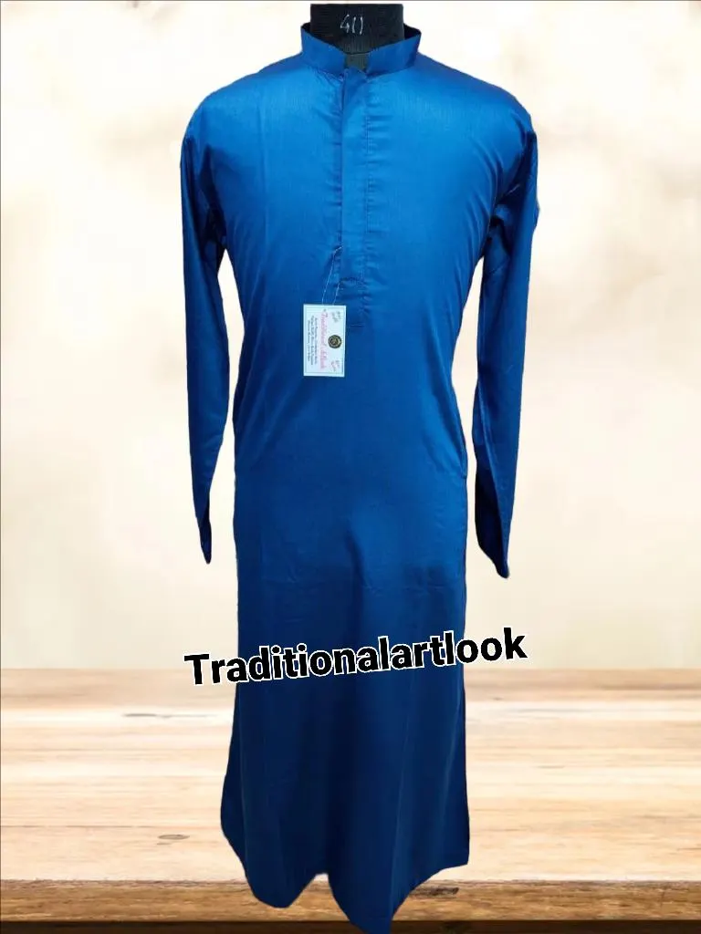 May include: A long-sleeved, cobalt blue tunic-style garment with a mandarin collar. The tunic has a buttoned placket and a small tag attached. The text "Traditionalartlook" is printed on the bottom of the image. The garment is displayed on a mannequin.