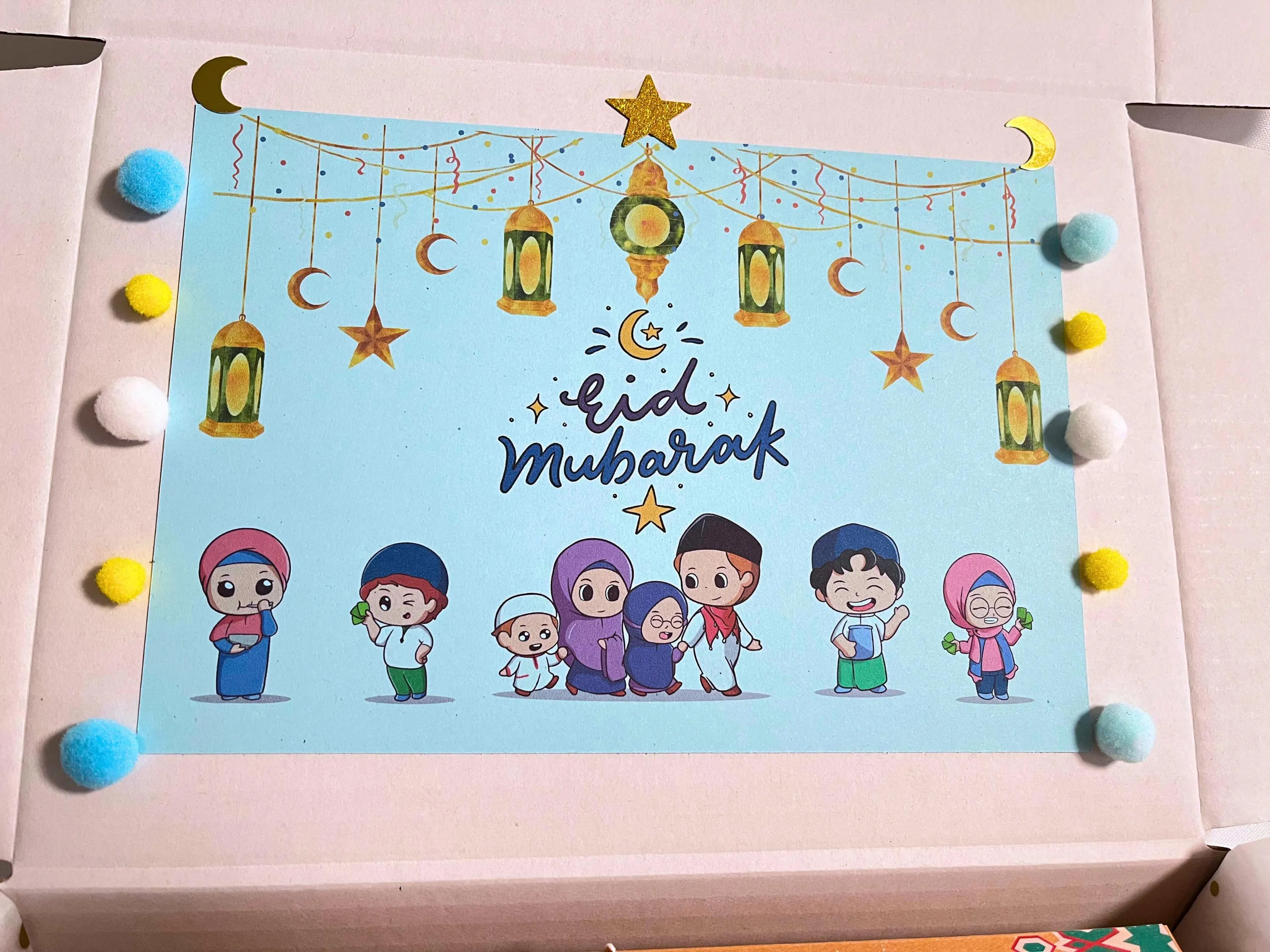 fun keyrings for eid, eid themed keyrings, eid stationery gift, fun paper glasses for kids, party paper glasses, eid party favors for boys, eidi display holder, eidi gift presentation, mosque shaped scratch art, islamic scratch art for kids, wooden pen for scratch art, islamic creative activities, 2 sets of eid stickers, islamic stickers set, fun sticker sets for kids, cherry flavored lollipop, eid candy treat, kids eid sweets, personalized eid treat box,
