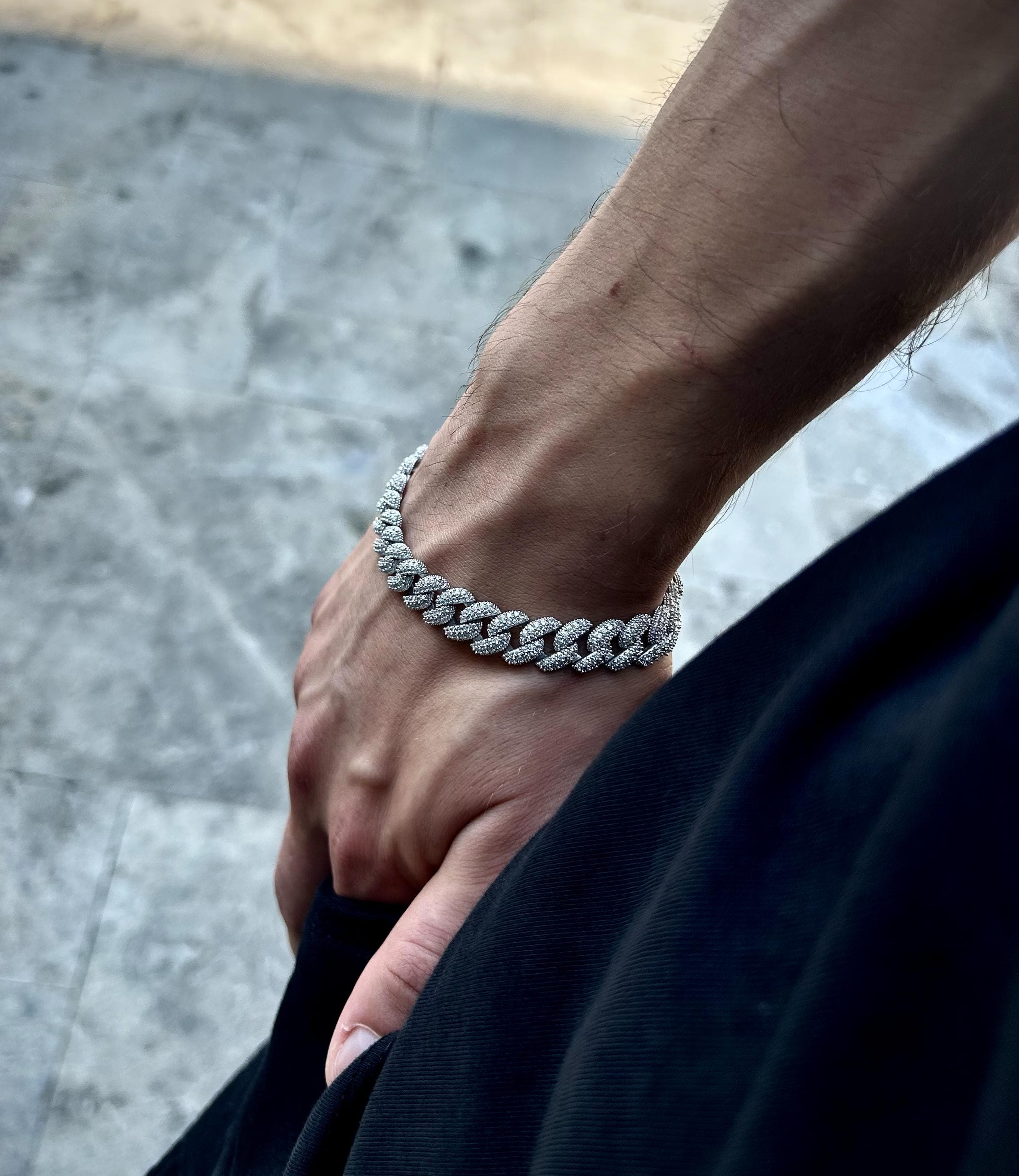 Crafted from 925 sterling silver and finished with rhodium plating, this iced Cuban bracelet offers timeless luxury and refined brilliance — a perfect gift for stylish men.