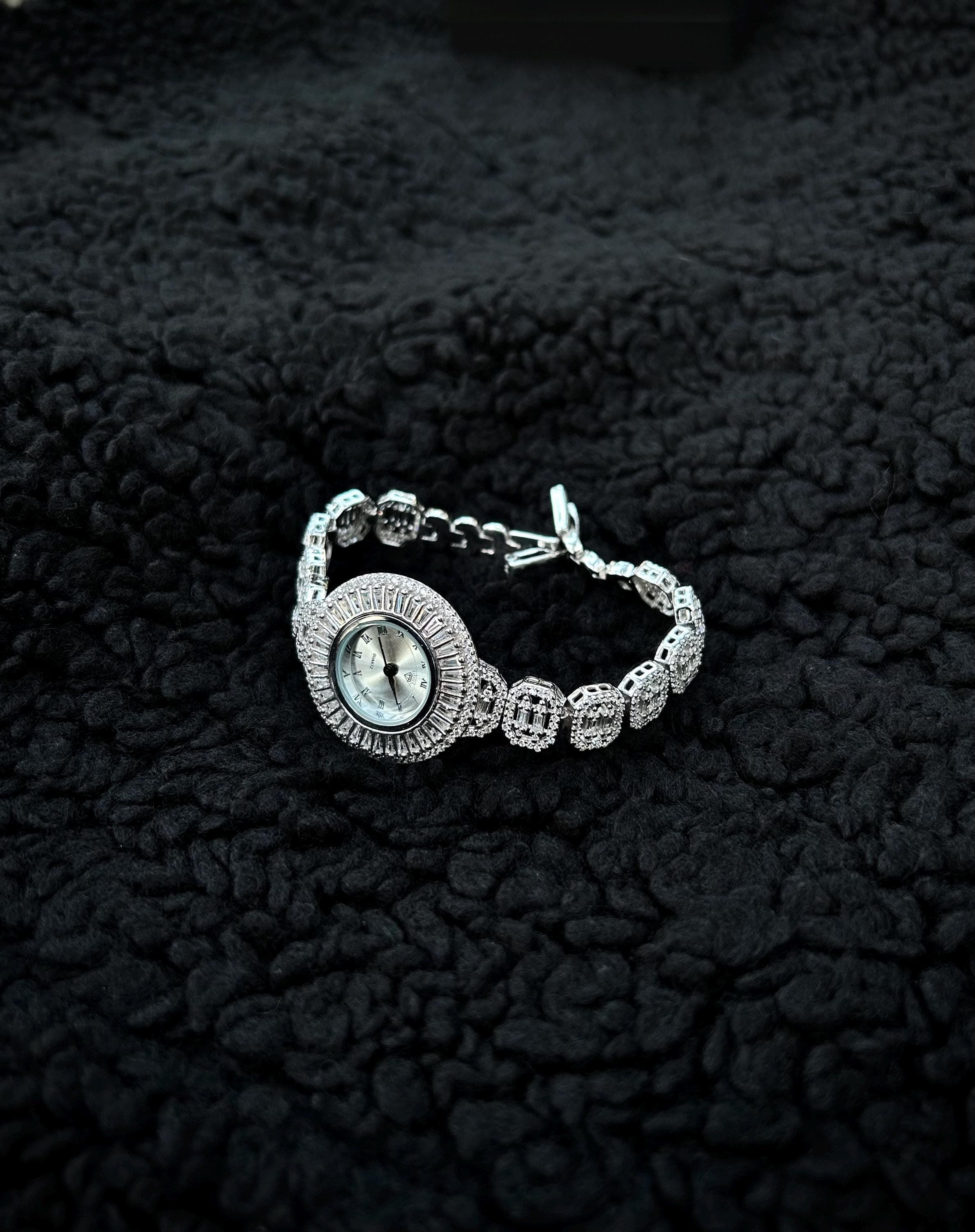Luxury round women's watch handcrafted from 925 sterling silver, rhodium plated for lasting shine, and set with brilliant zircon gems. An elegant jewelry gift ideal for anniversaries, special occasions, or everyday luxury.