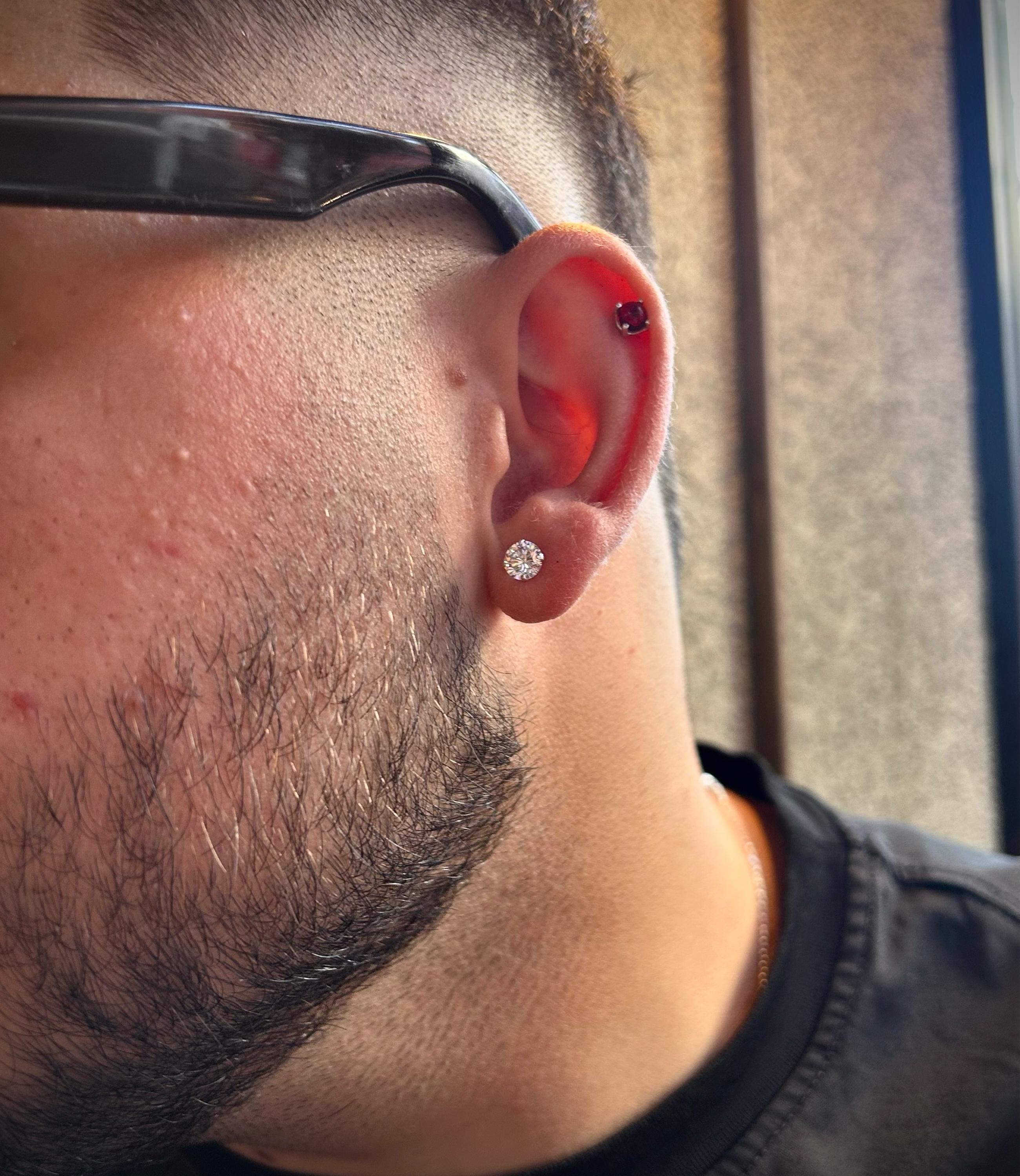 6mm CZ stud earrings for men in polished 925 silver, placed on a clean dark background with lighting focused on the sparkle, evoking Ronaldo’s signature footballer style.