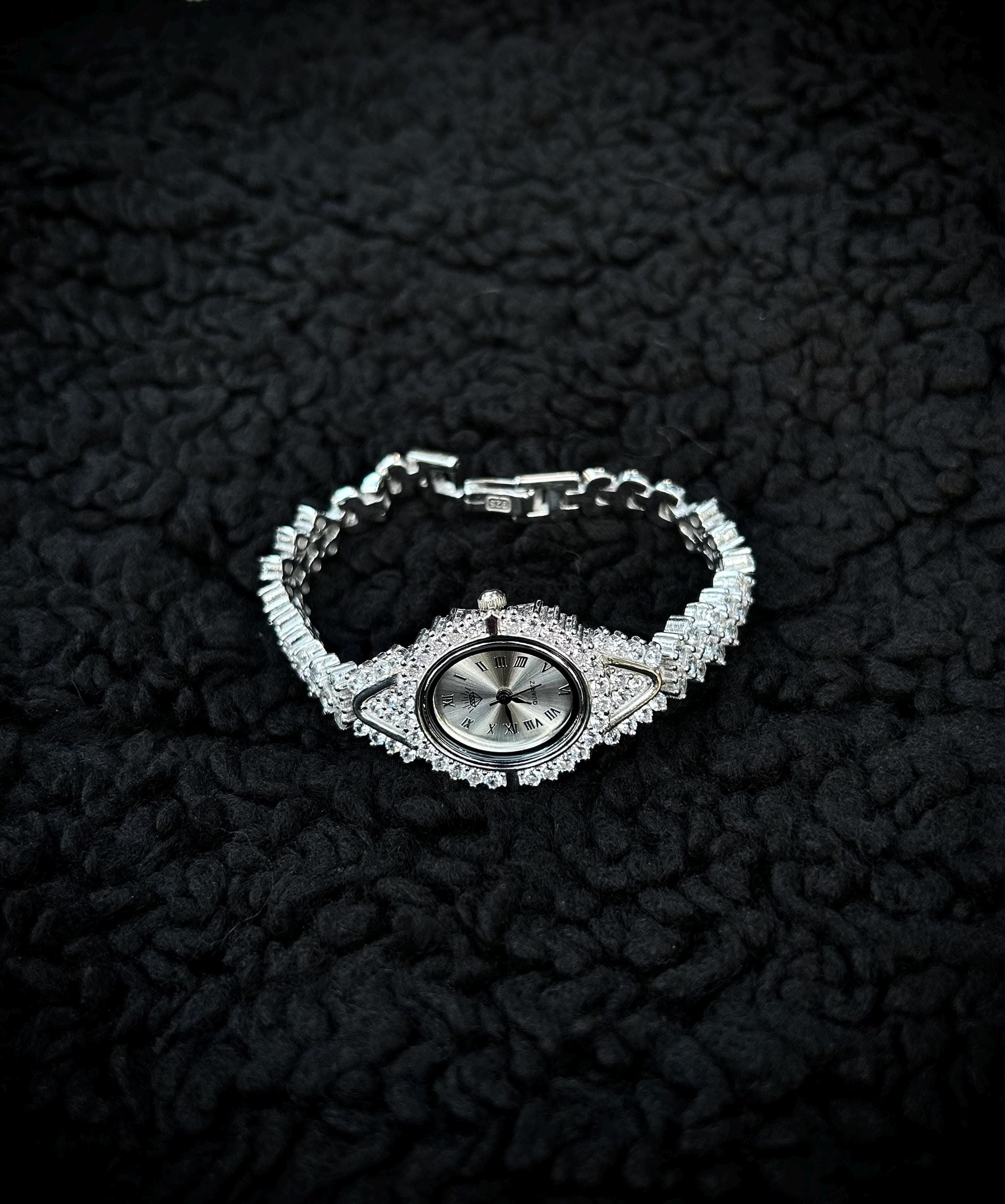 Luxury silver bracelet watch for women featuring shimmering zircon stones and elegant handmade design.