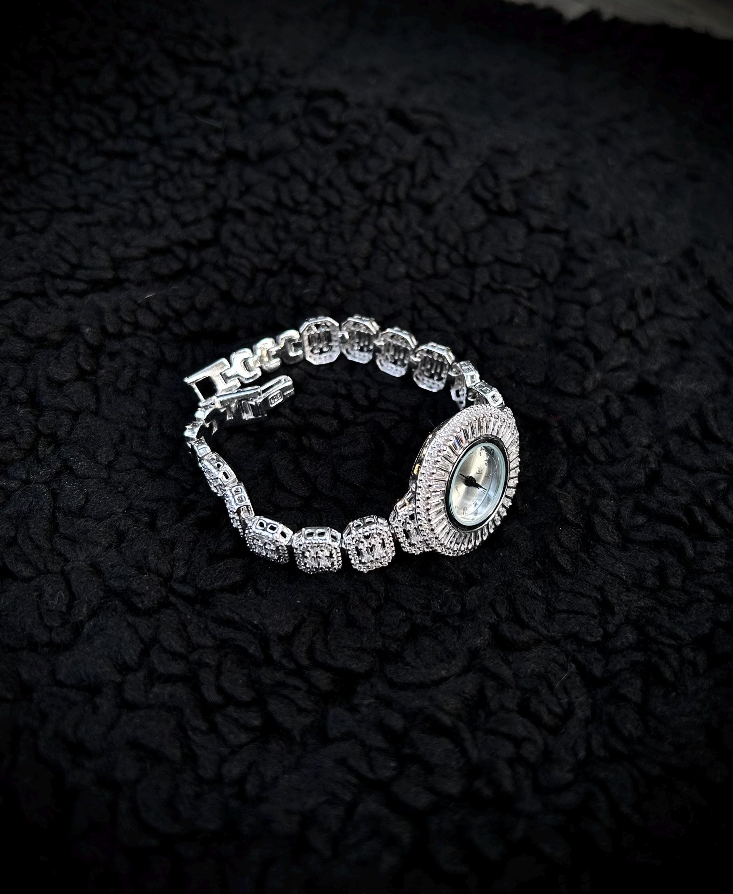 Luxury round women's watch handcrafted from 925 sterling silver, rhodium plated for lasting shine, and set with brilliant zircon gems. An elegant jewelry gift ideal for anniversaries, special occasions, or everyday luxury.