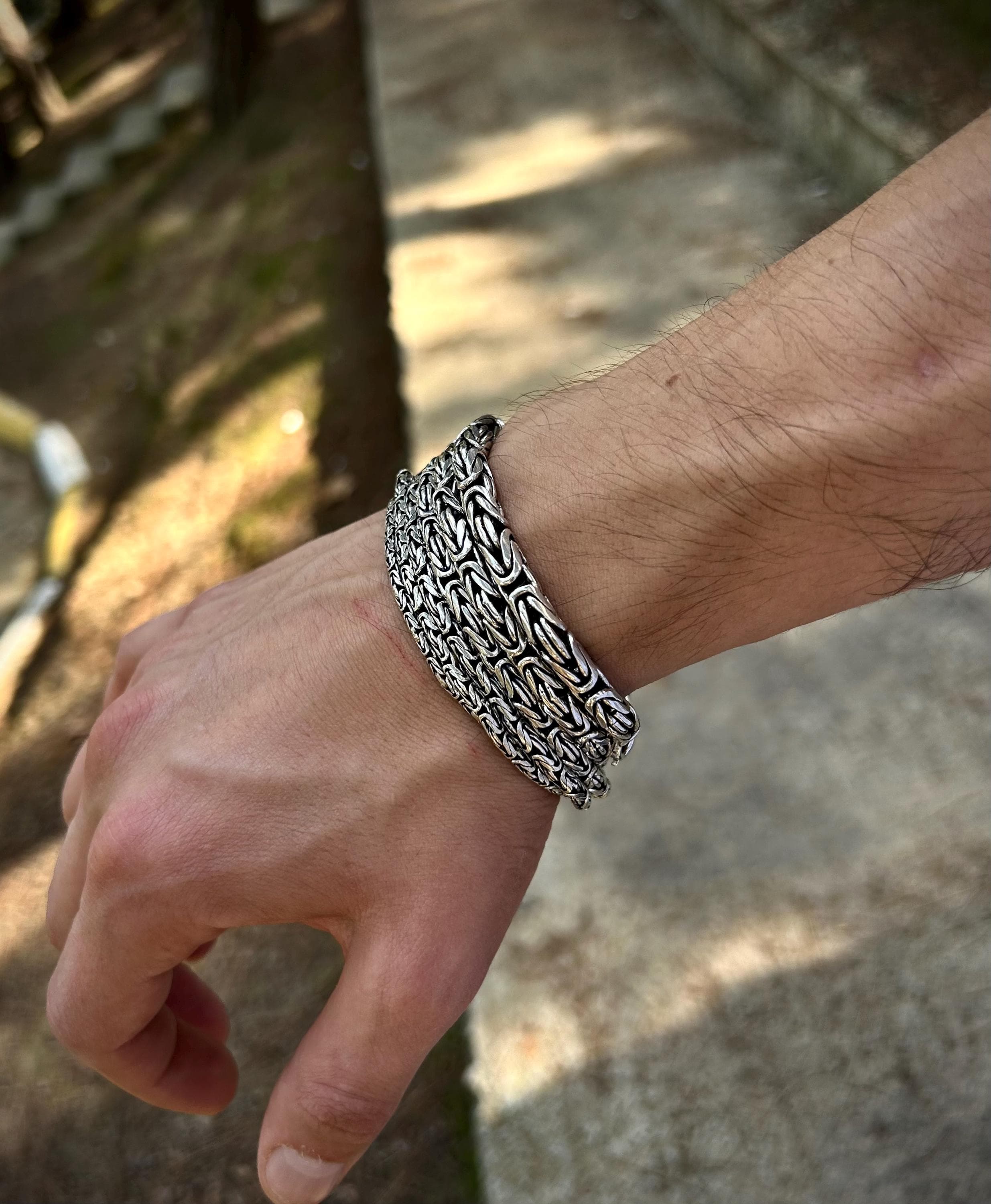These Sterling Silver Bali Byzantine Chain Bracelets feature a round-cut design in various sizes (2mm, 2.5mm, 3mm, 4mm, 5mm). Crafted from solid silver, they offer timeless style and durability,