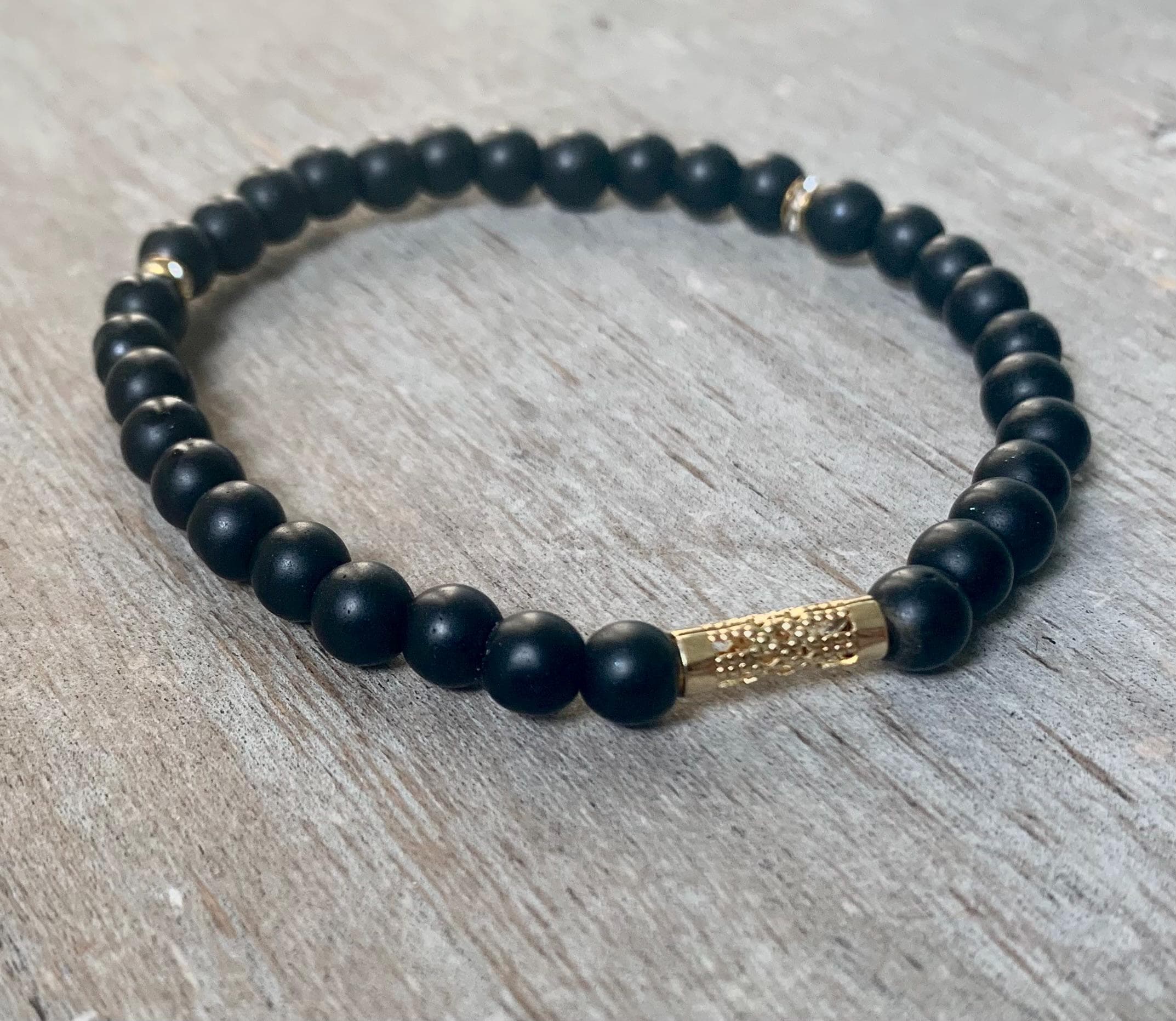 Black Onyx Tasbih Bracelet (33 Beads) with Gold Plated Spacers