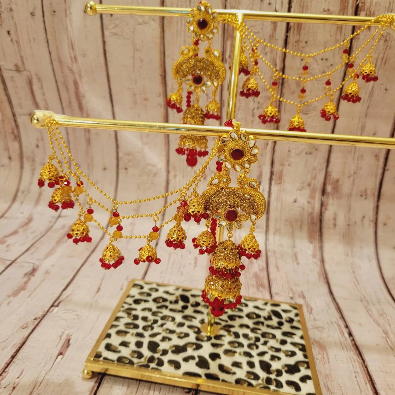 Sahara jhumky in champagne gold and Red gold color