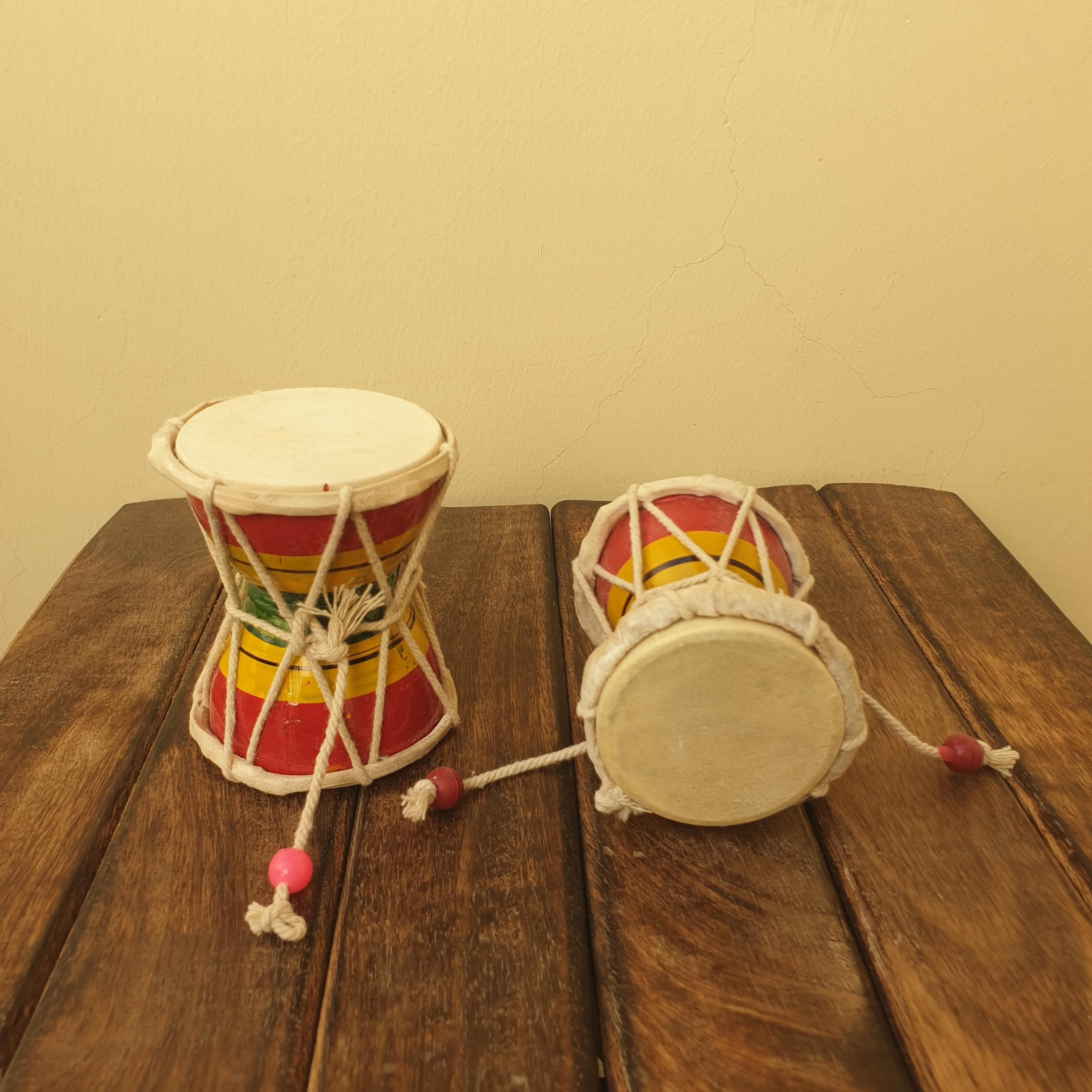 damru for shiv puja,
lord shiva musical instrument,
handmade shiva damru,
wooden damru for meditation,
hindu prayer drum,
shiva damru toy,
mahashivratri gift item,
spiritual gift for devotees,
Handmade Wooden Damroo,
Lord Shiva Damru Instrument,
Shiva Prayer Drum,
Painted Wooden Damru,
Hindu Musical Instrument,
Spiritual Prayer Drum,