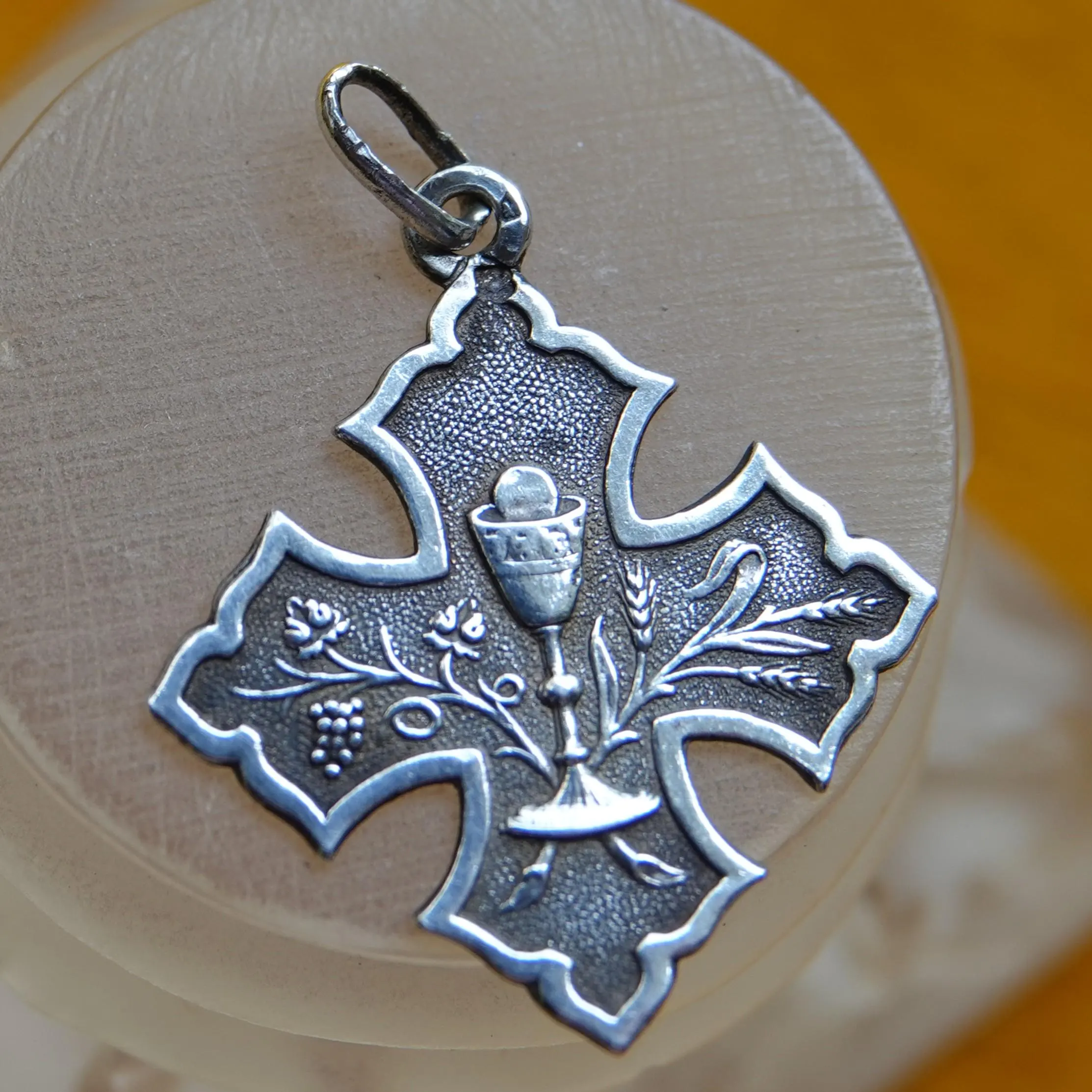 Antique silver Eucharist charm in the shape of a Cross
