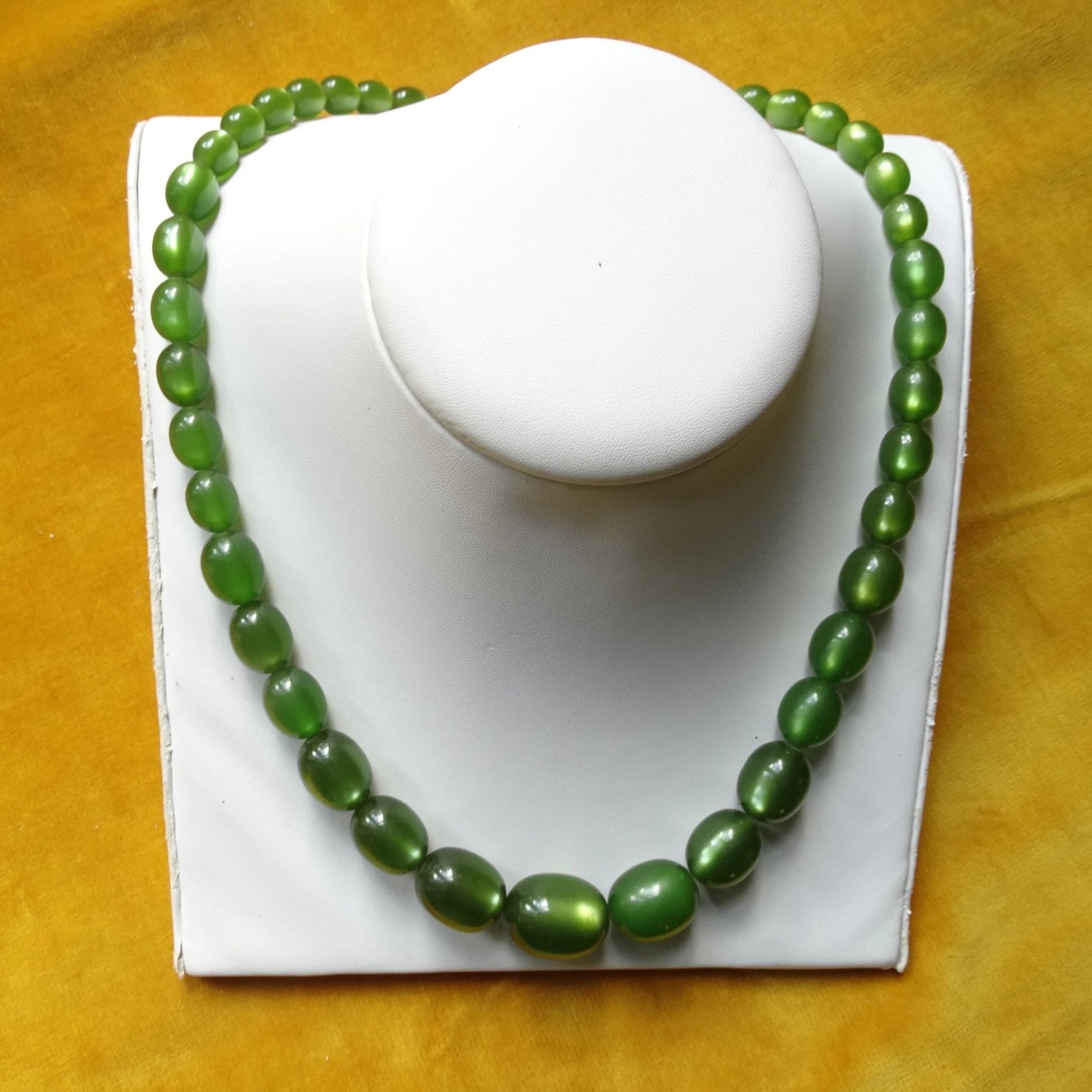 Necklace with green plastic satin look beads/Mid century costume jewellery