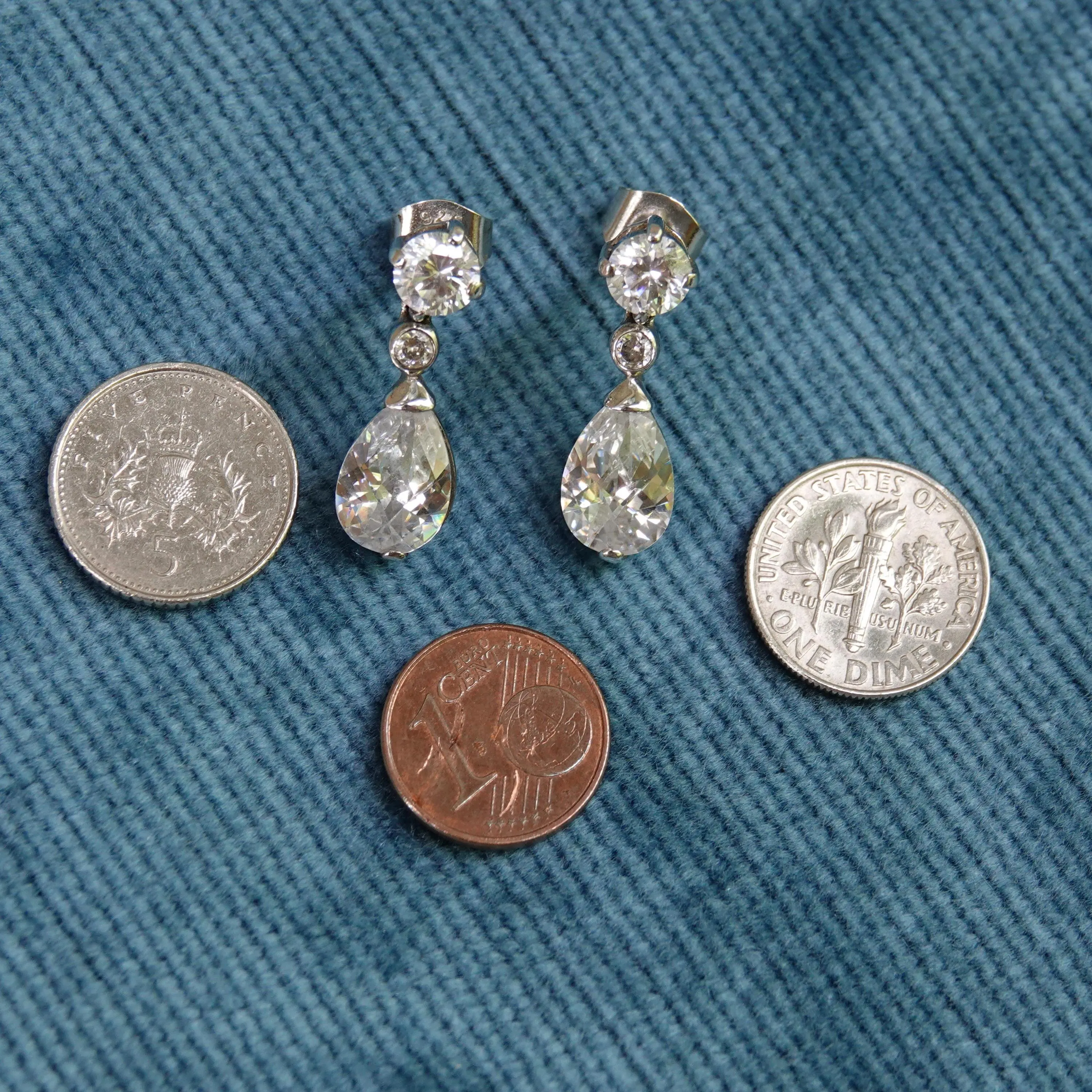 Pear drop crystal & silver earrings with coins for scale