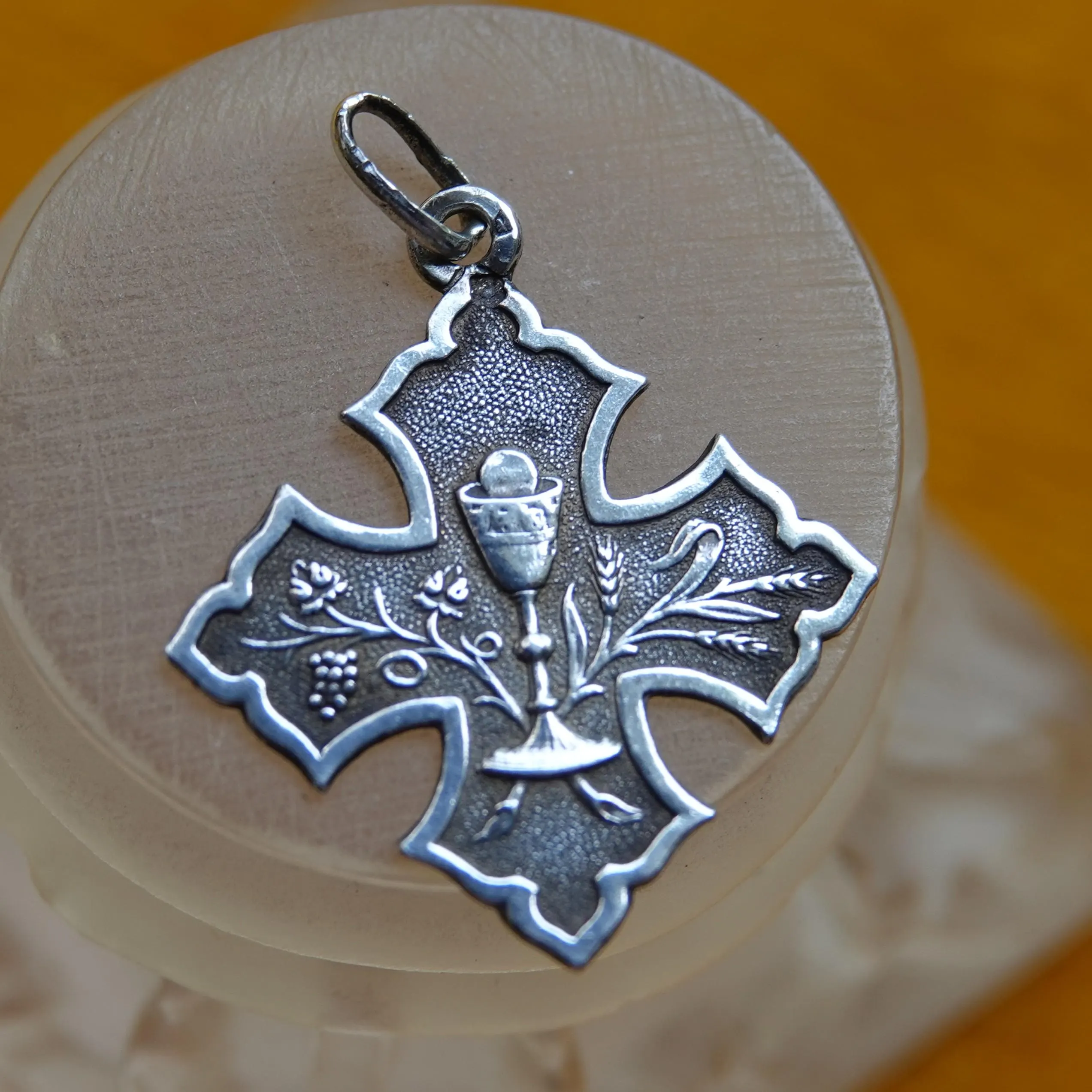 Antique silver Eucharist charm in the shape of a Cross