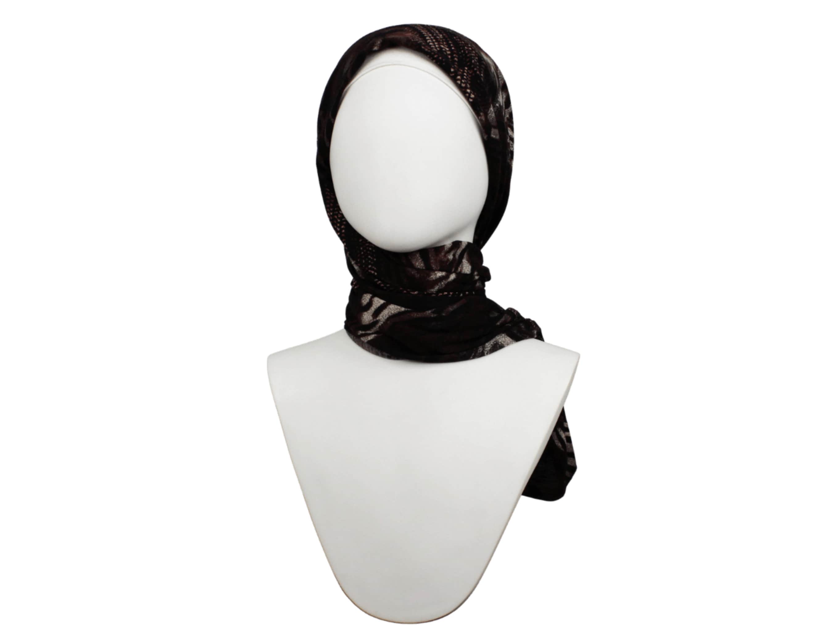 This brown hijab is so elegant you'd want to wear it on a daily basis. A printed jersey hijab for work.