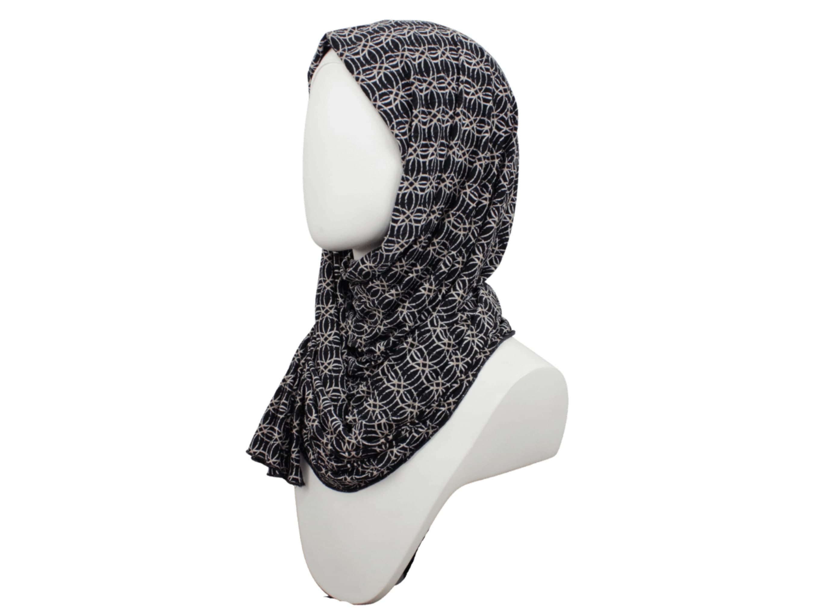 Black hijab. This printed jersey black beige hijab is so classy and it's designed with your needs in mind.