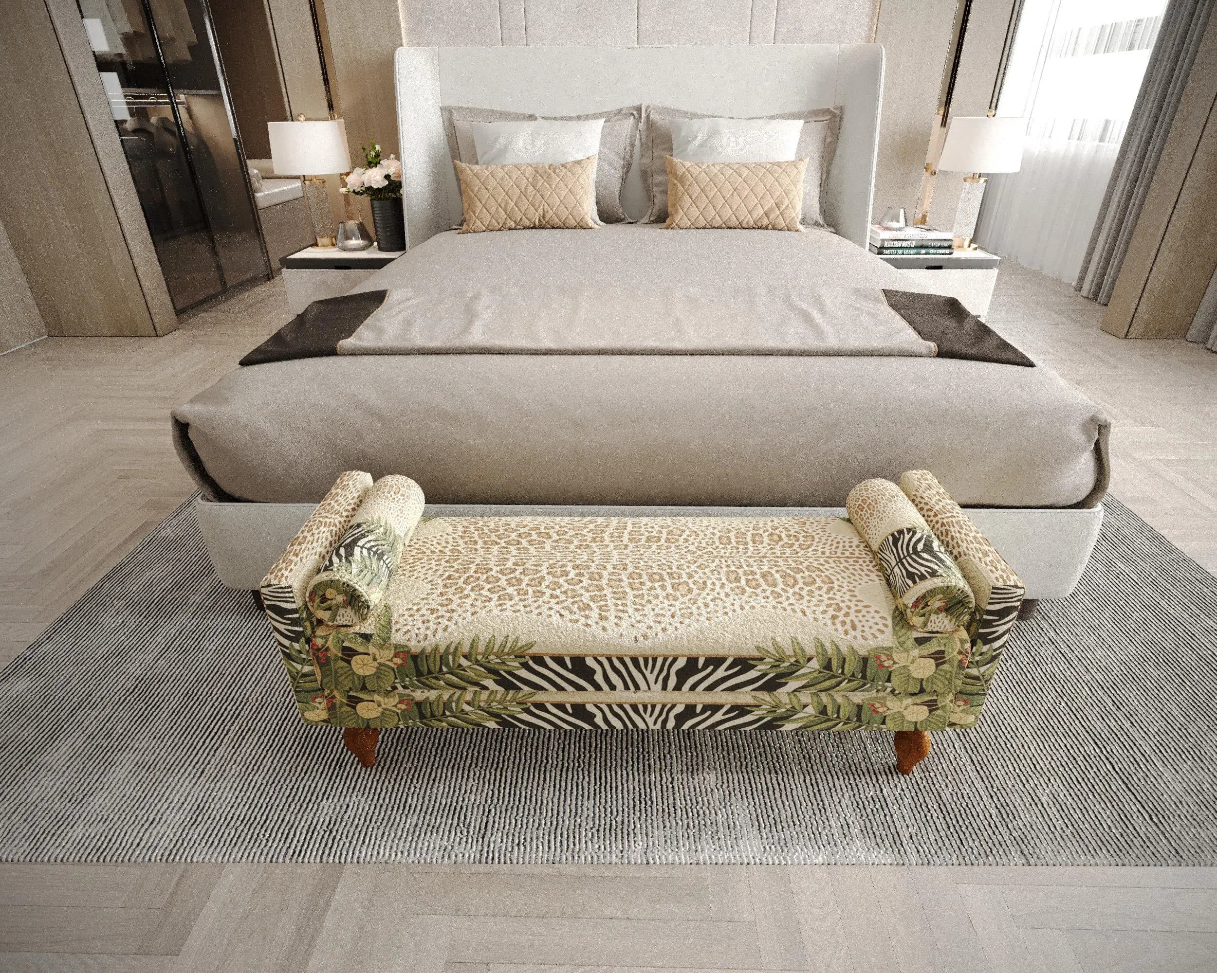a well-furnished bedroom with a large bed, a bench, and a rug.