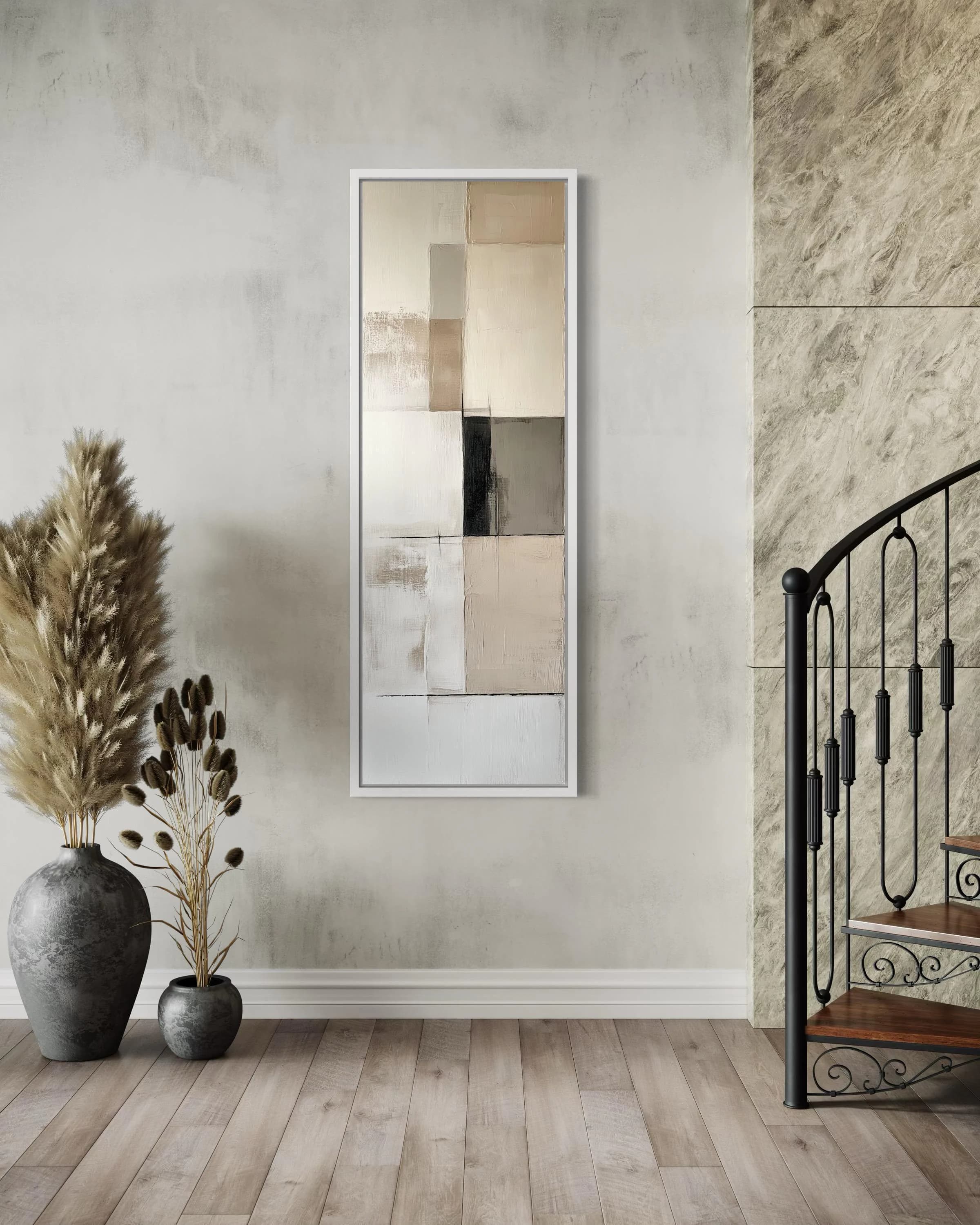 a minimalist interior design with a large abstract painting hanging on the wall, a staircase with a black railing, and two potted plants placed on the floor.