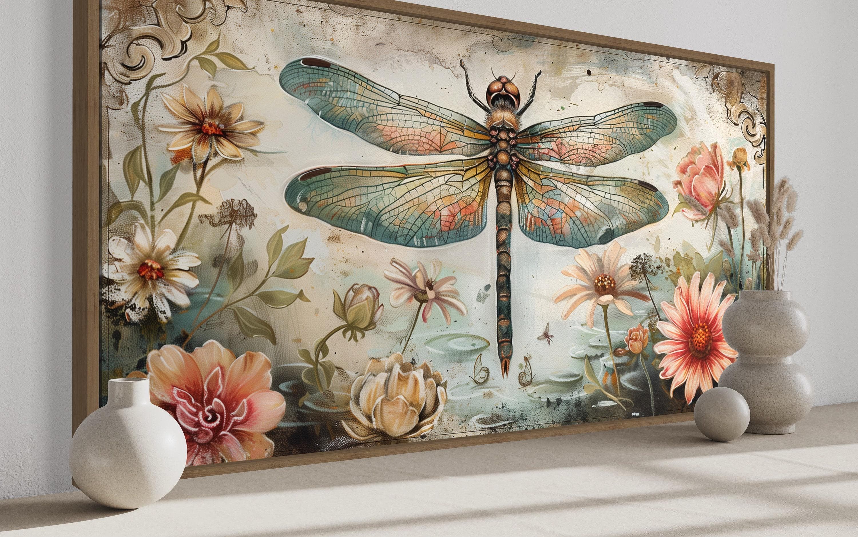 a large, colorful painting of a dragonfly surrounded by flowers and plants, with a vase of flowers placed in front of it.