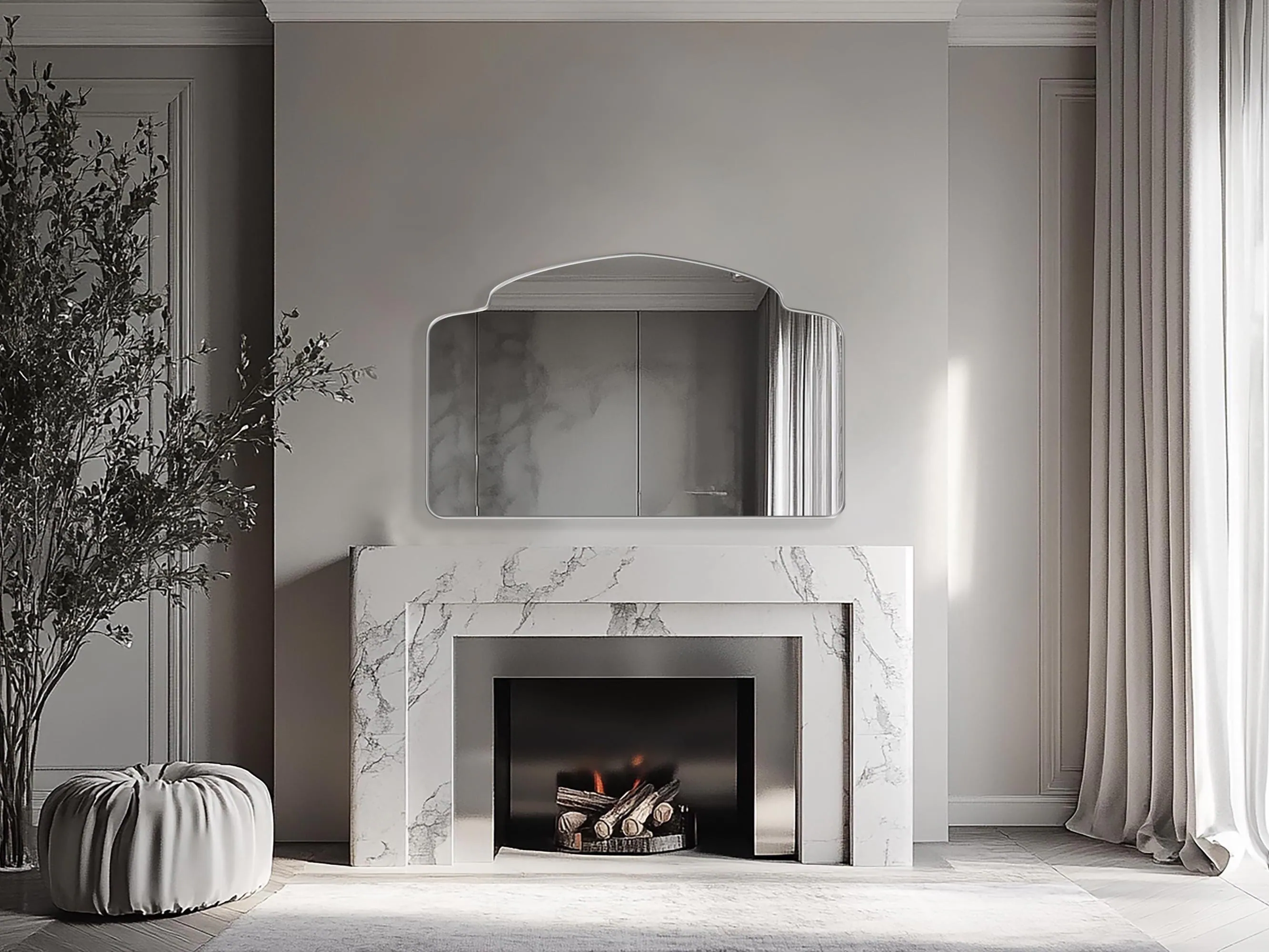 Alhambra Mirror with silver frame finish hung on the wall of a living room over a fireplace.