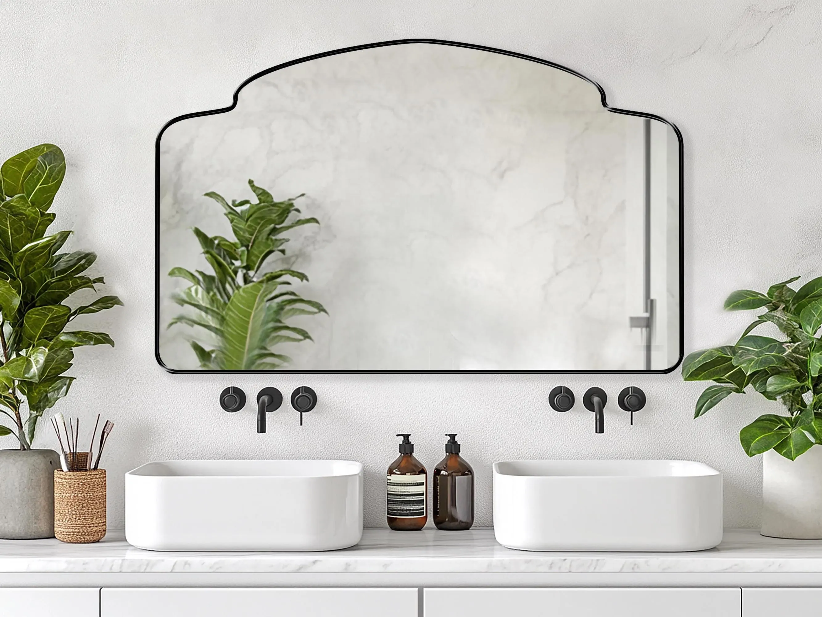 Alhambra Mirror with black frame finish hung on the wall of a bathroom over a double vanity.