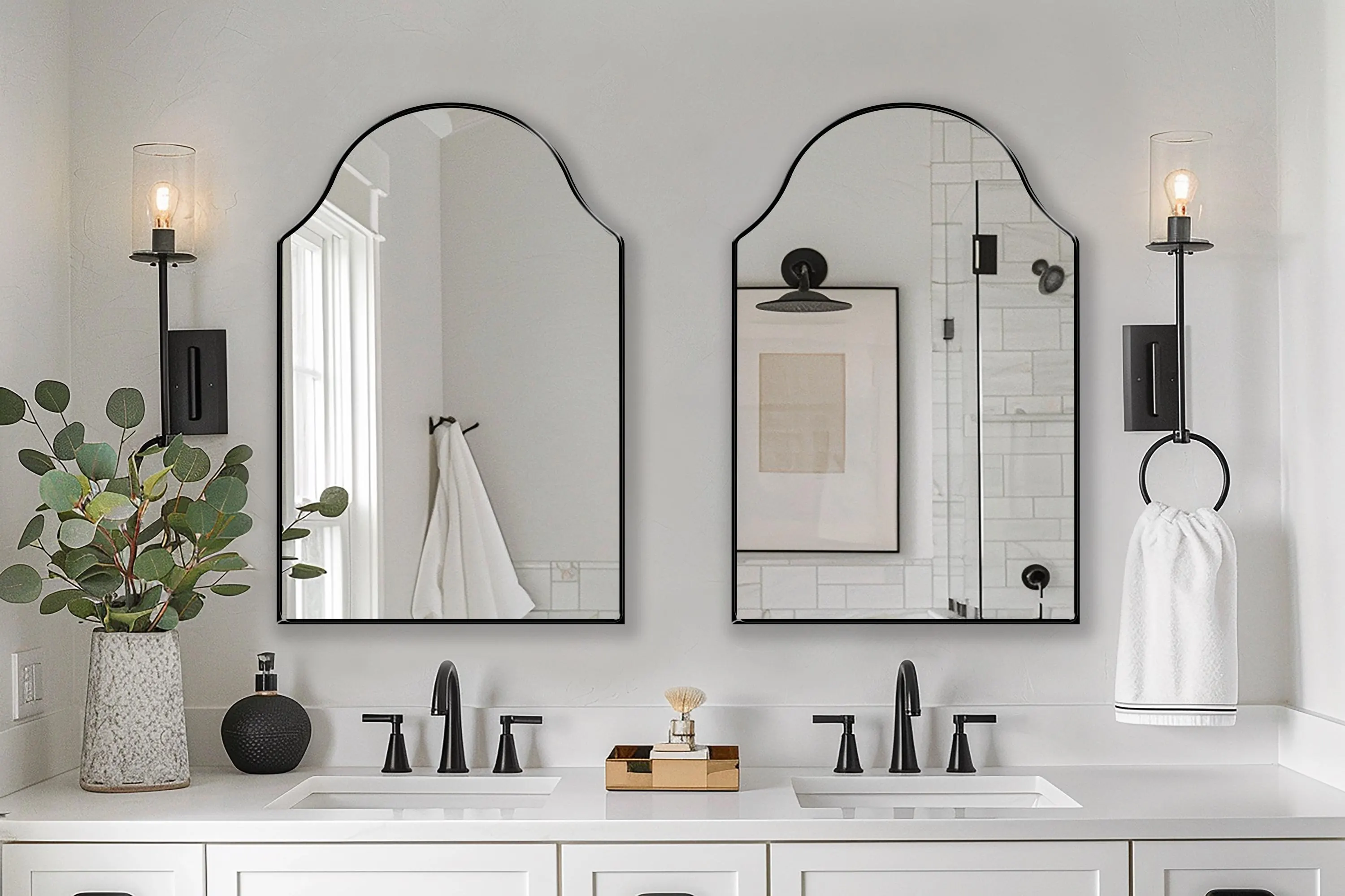 Two Andalusia Mirrors with black frame finish hung on the wall of a powder room over a double vanity.