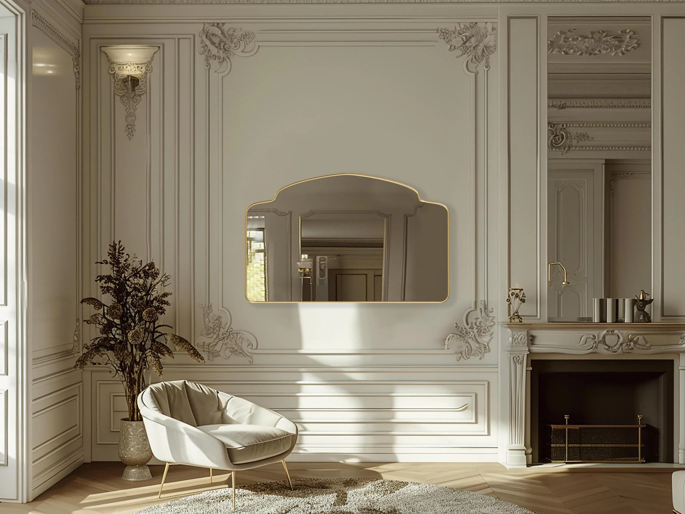 Alhambra Mirror with gold frame finish hung on the wall of a living room.