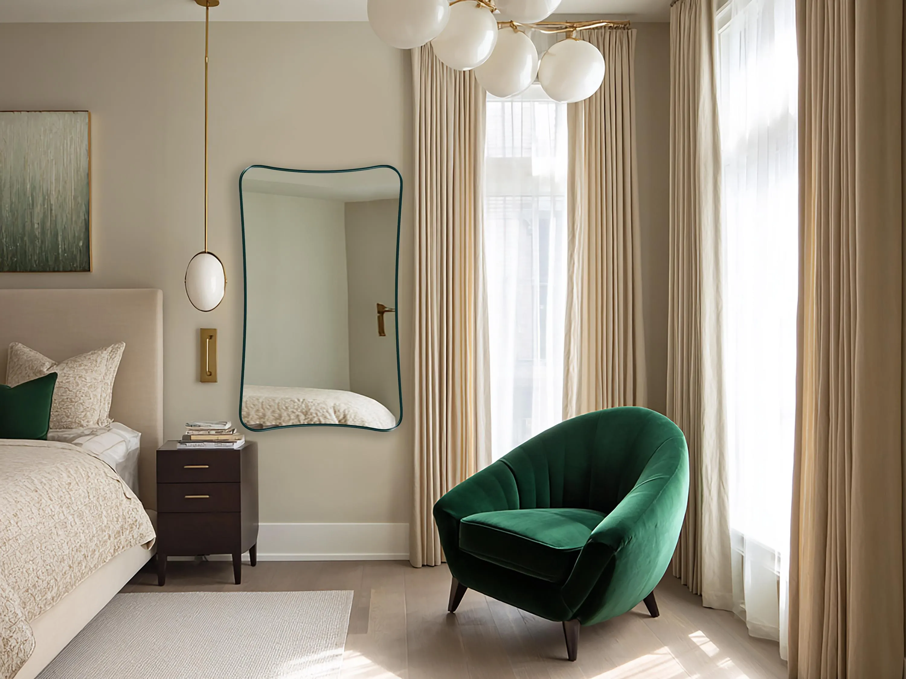 Talisman Mirror with emerald frame finish hung on the wall of a bedroom.