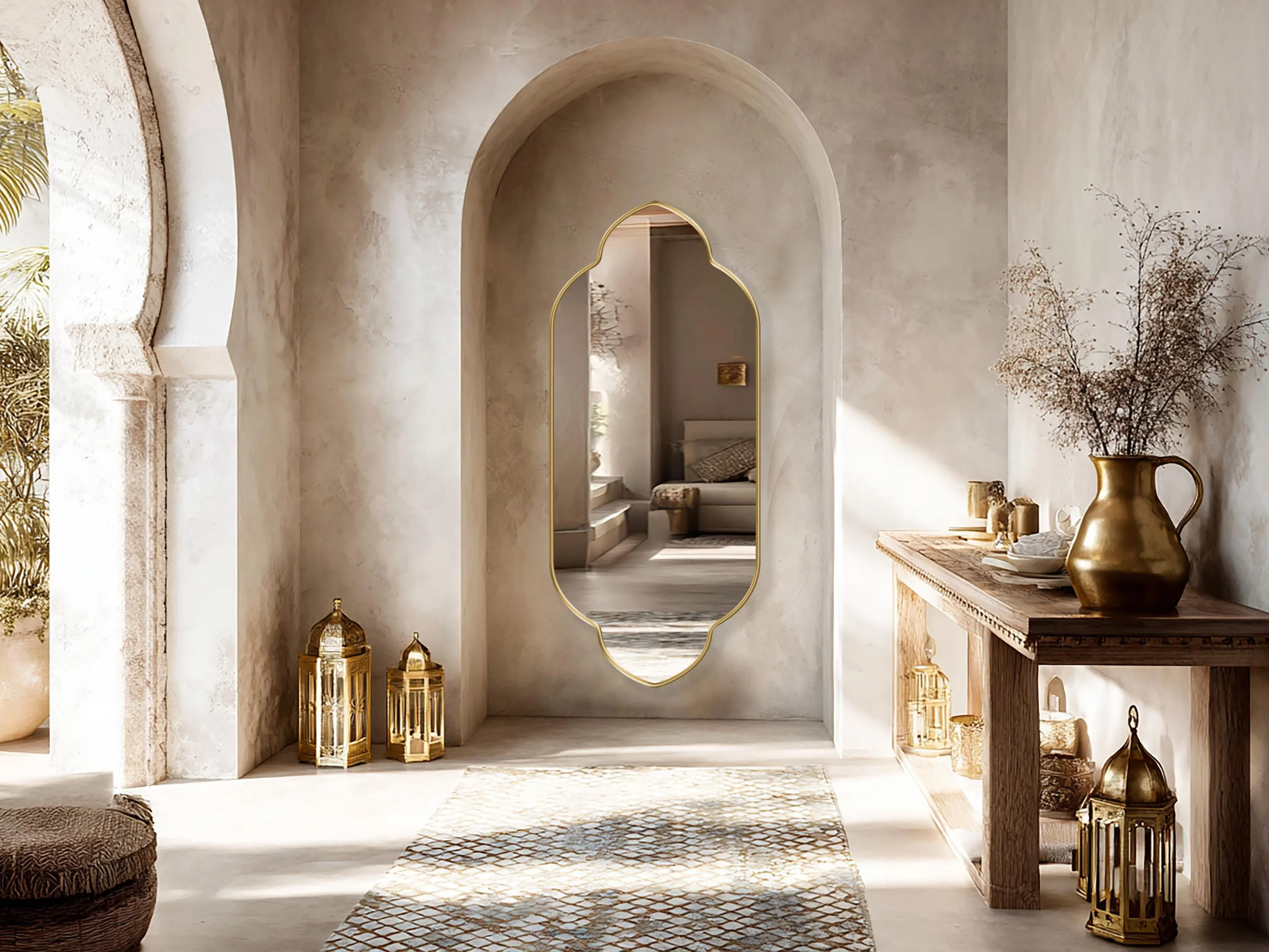 Zafira Mirror with gold frame finish hung on the wall of a bohemian hallway.