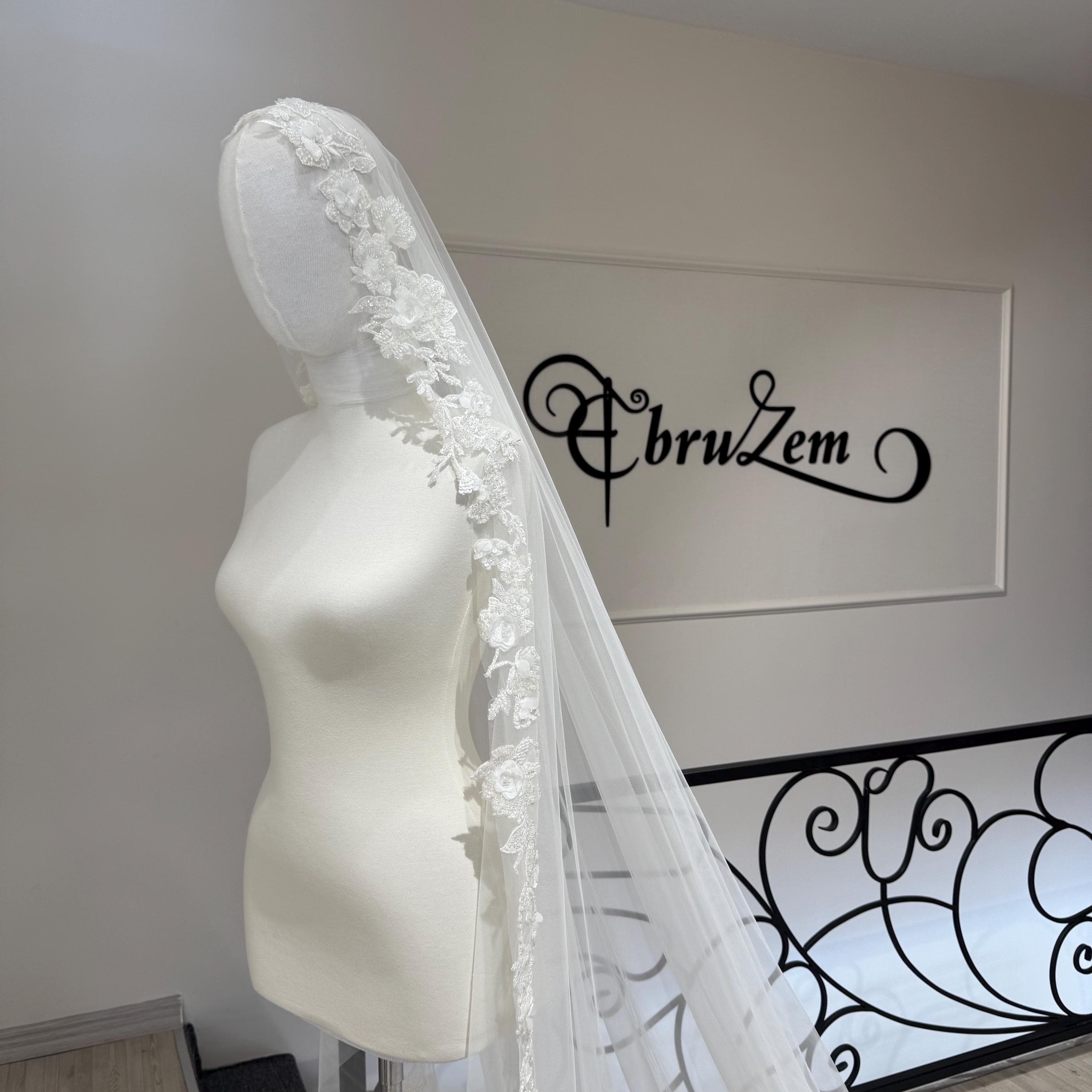 The flower veil integrates with the wedding dress and the bridal veil