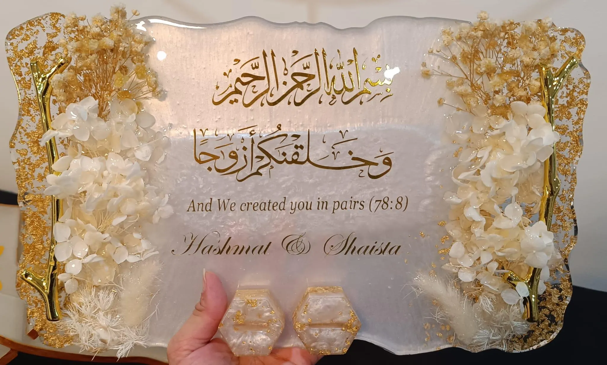 white and gold tray with tree branch handle