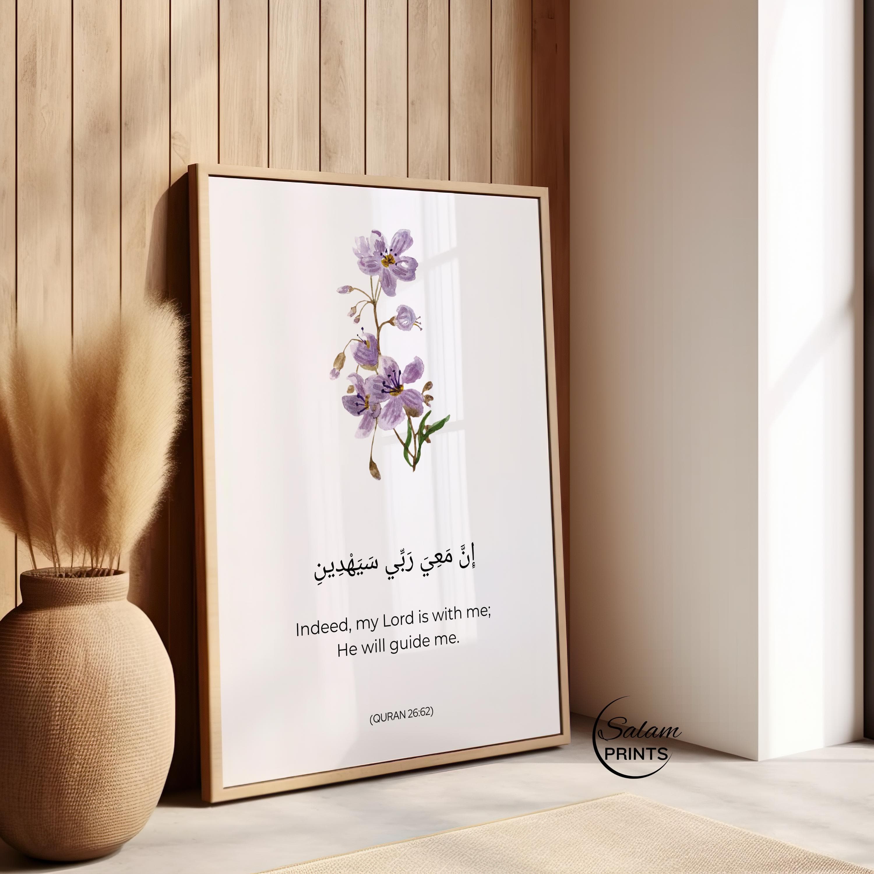 Purple colored flowers on white background with arabic calligraphy of Motivating Quran Verse 8:46 written below the floral design . Indeed My Lord is with me, He will Guide me. and below it is written its english translation .This minimalist Quranic verse print showcases the importance of Reliance on Allah in Islamic Lives. Adorned with Minimalist flower and arabic Calligraphy and english translation, This is a perfect Islamic poster for Muslim Homes.