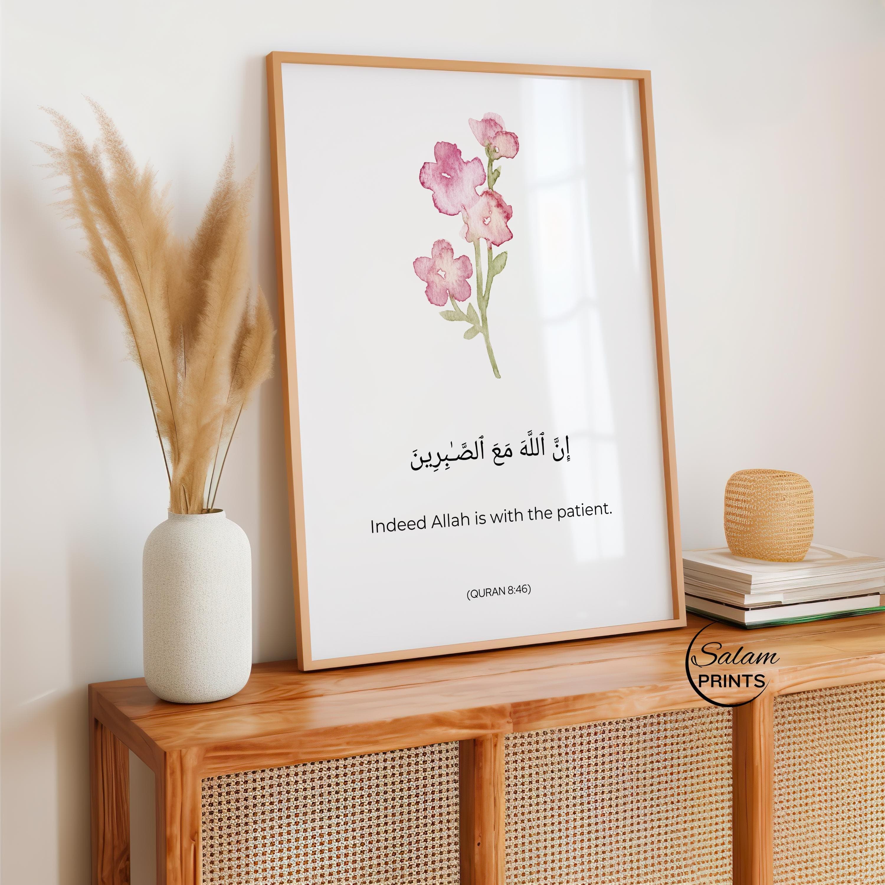 QURAN QUOTE ART ,  A WATERCOLOR FLOWER IN PINK AND GREEN , BELOW IT IS WRITTEN QURAN VERSE - '' INDEED ALLAH IS WITH THE PATIENT'' IN ARABIC CALLIGRAPHY AND ENGLISH TRANSLATION.
