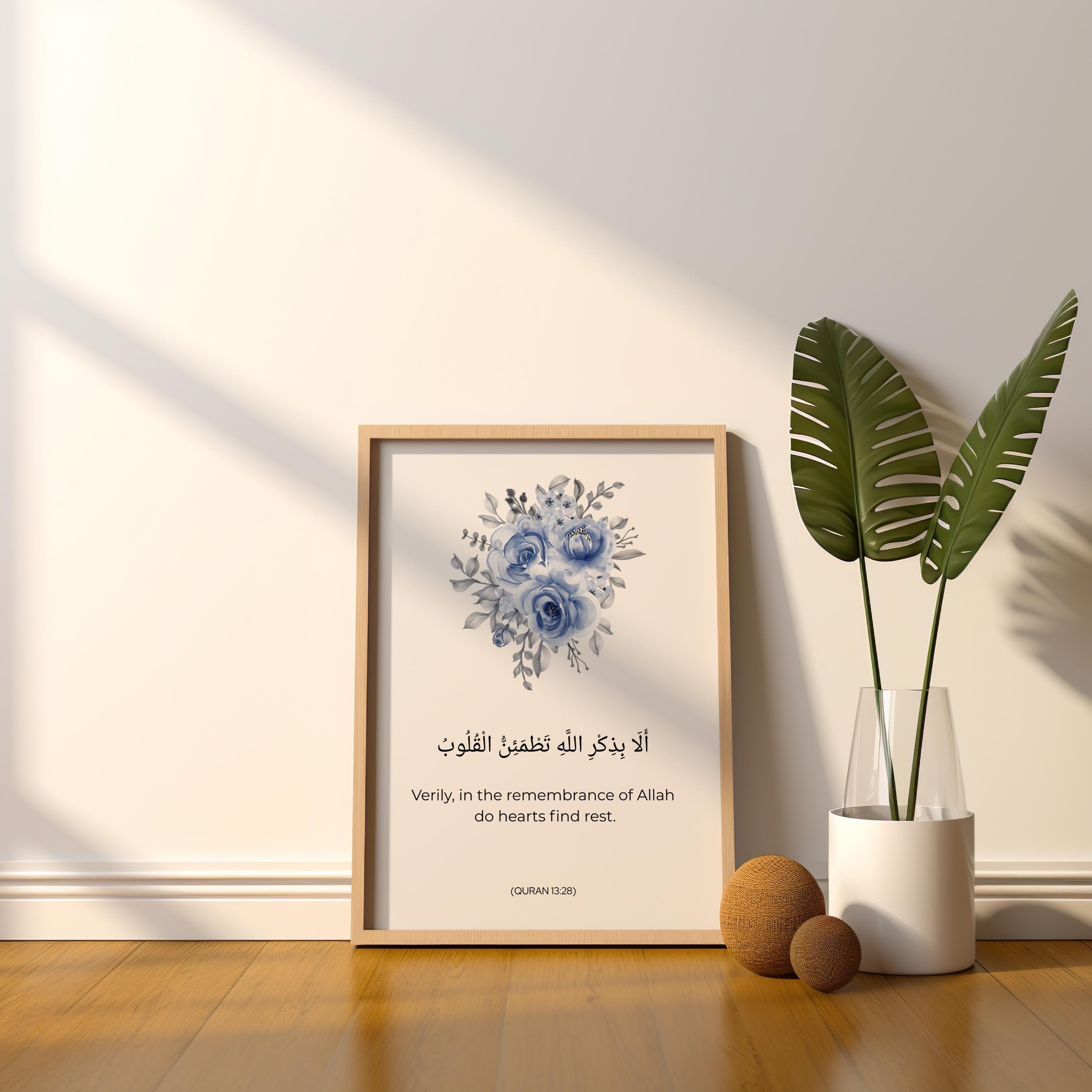 QURAN QUOTE ART ,  Minimalist WATERCOLOR FLOWERs IN blue  on white background  , BELOW IT IS WRITTEN QURAN VERSE - '' Verily in the remembrance of Allah do heart find rest.'' IN ARABIC CALLIGRAPHY AND ENGLISH TRANSLATION.