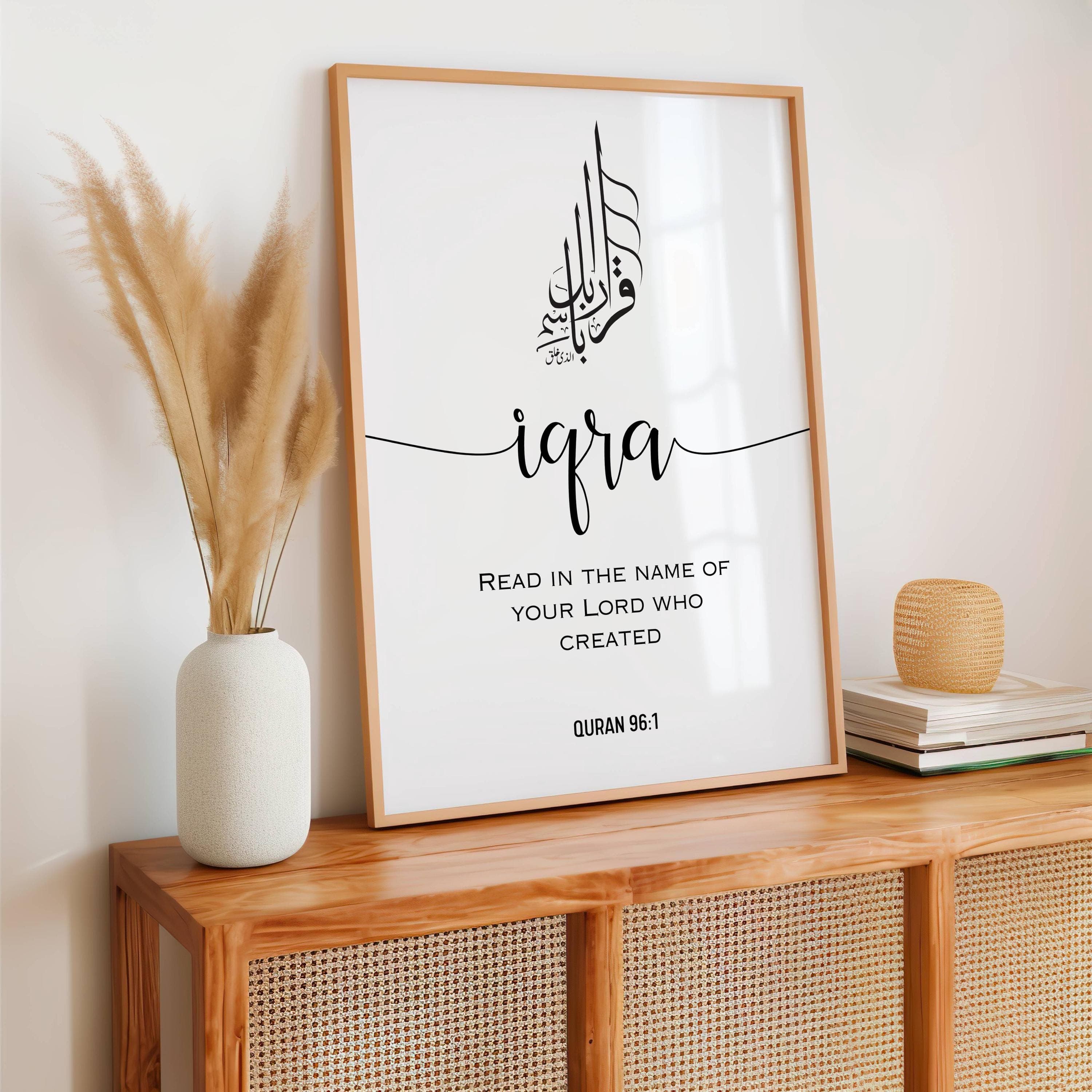 Minimalist Arabic calligraphy featuring the Quranic verse IQRA ;Read in the name of your Lord who created(Quran 96:1) in an elegant black-and-white design. Below it is written the full verse translation in engl;ish in capital easy to read letters this  modern elegant fonts decor adds a modern touch, making it perfect for a study, prayer room, or living space. This Islamic digital download is ideal for Muslim home decor, Quran-inspired art, and unique Islamic gifts, bringing faith into any space.