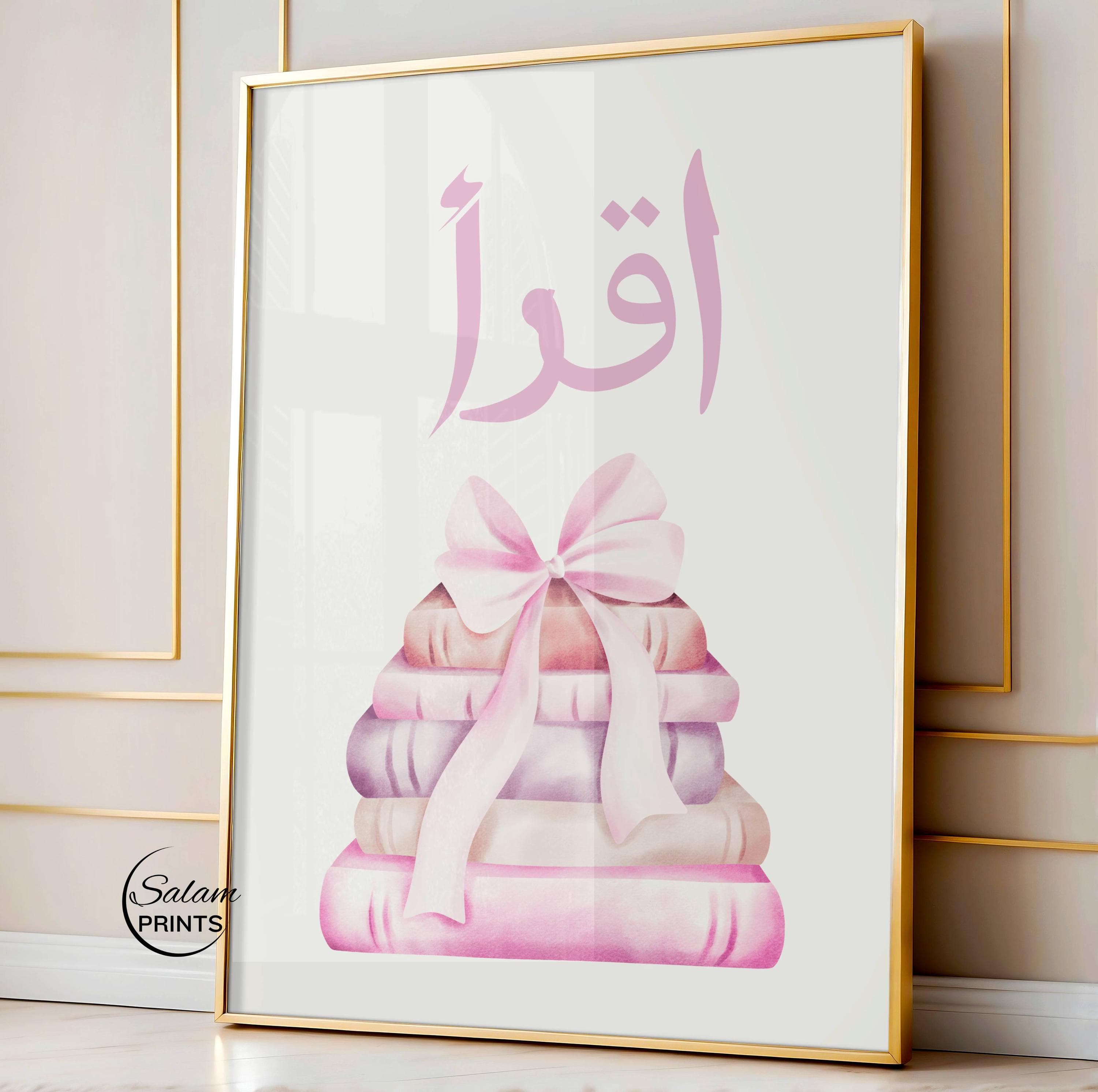 Iqra Islamic wall art printable for kids featuring soft pink bow and stacked books illustration, Quran quote “Iqra” meaning read, perfect for Muslim nursery decor, girls room wall art, Islamic learning poster for study space, baby room decoration, pastel pink nursery print, Eid gift for kids, modern minimalist Islamic home decor, digital download printable art for children’s bedroom or playroom