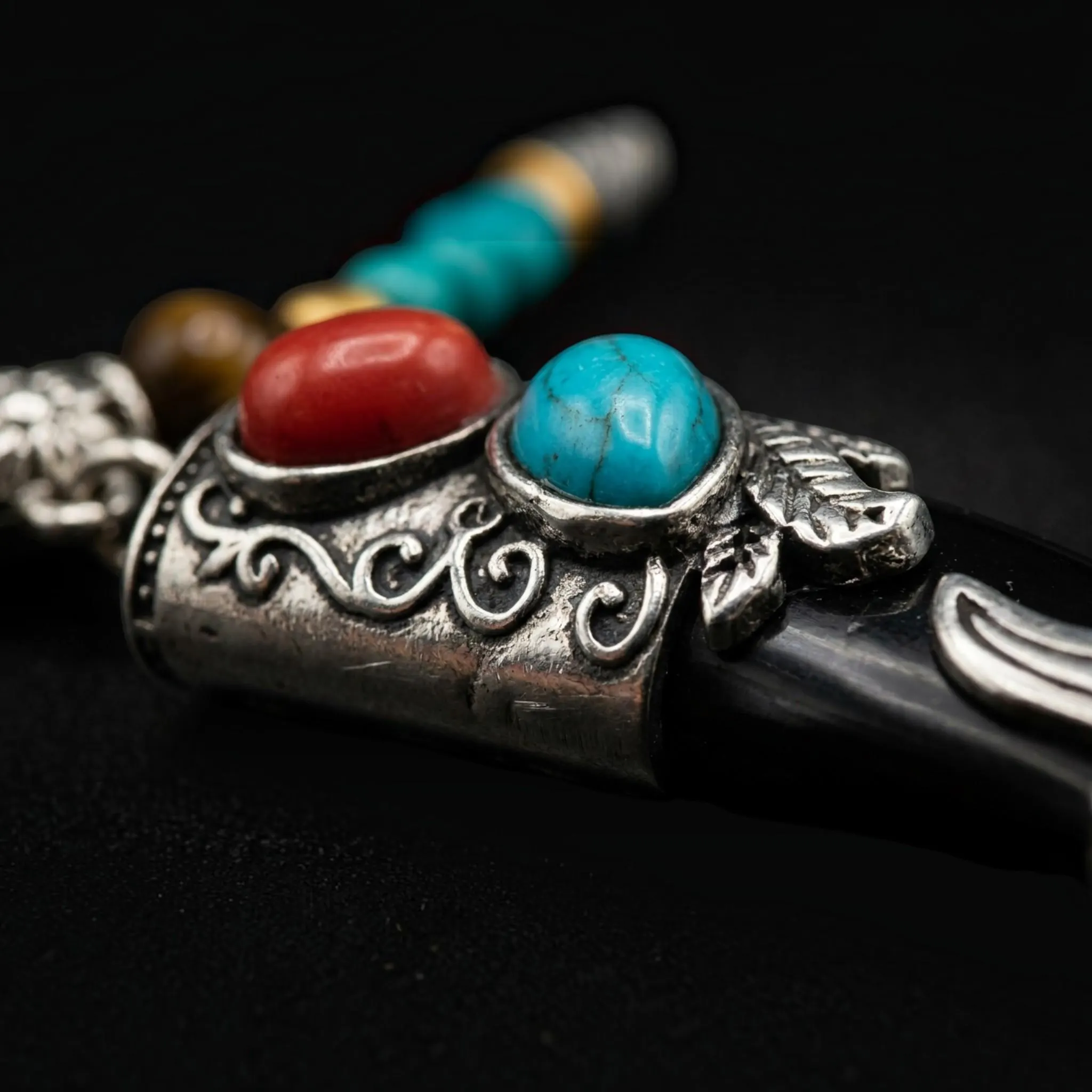 Mens tooth fang pendant necklace with engraved silver details, black onyx color shaman protection amulet, ethnic statement jewelry flat lay