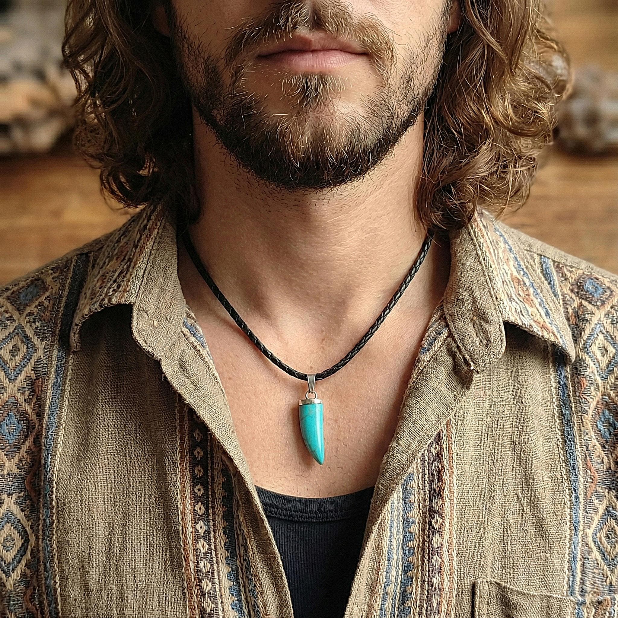 Men's turquoise necklace featuring a horn shaped pendant on a black braided leather cord, boho surfer style jewelry perfect for boyfriend gift.
