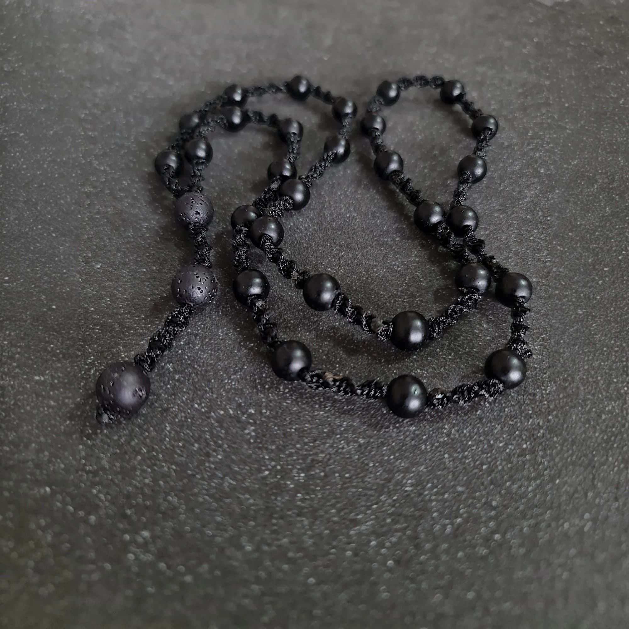 Handmade long mala necklace for men featuring black onyx and lava stones in a minimalist design