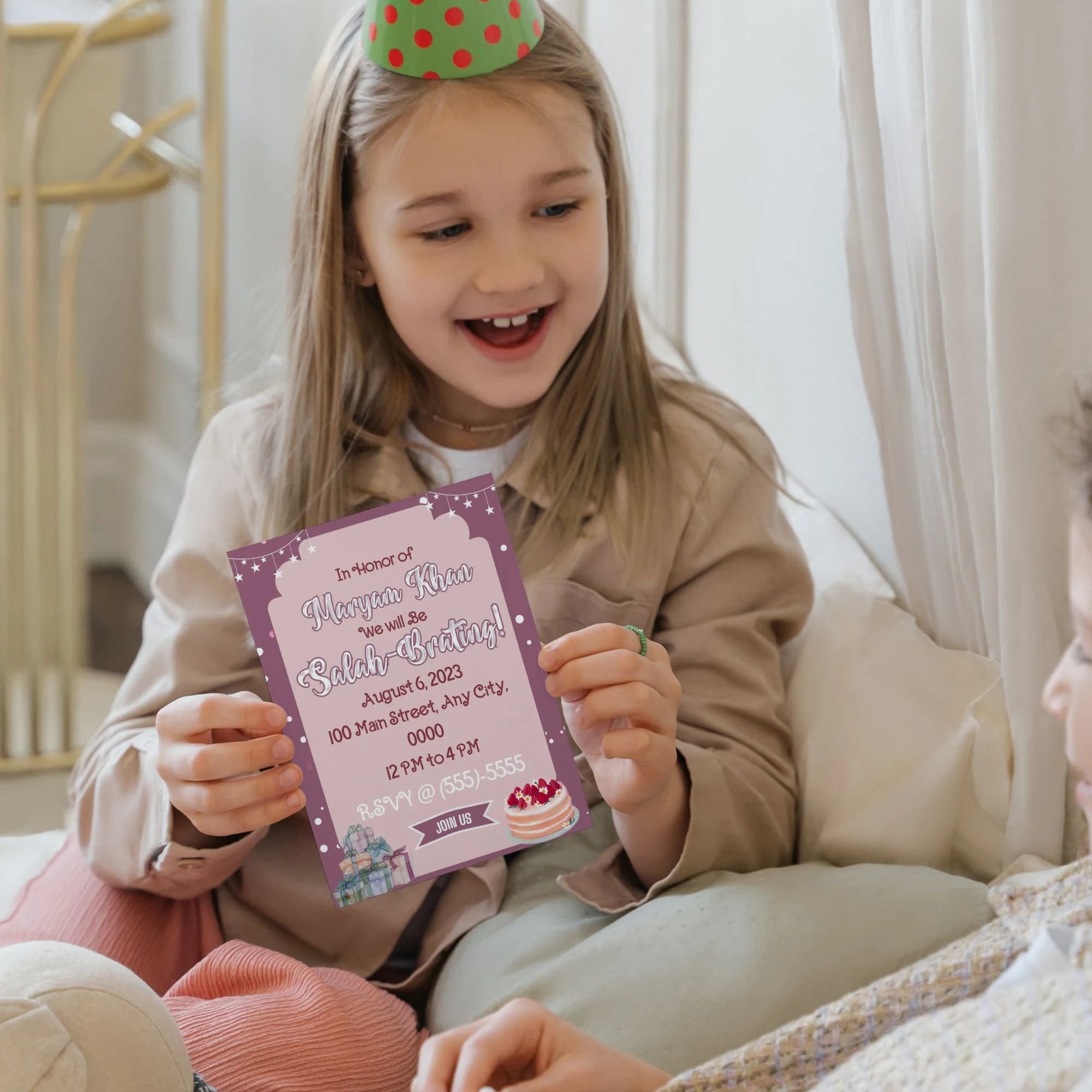 little girl holding muslim invite