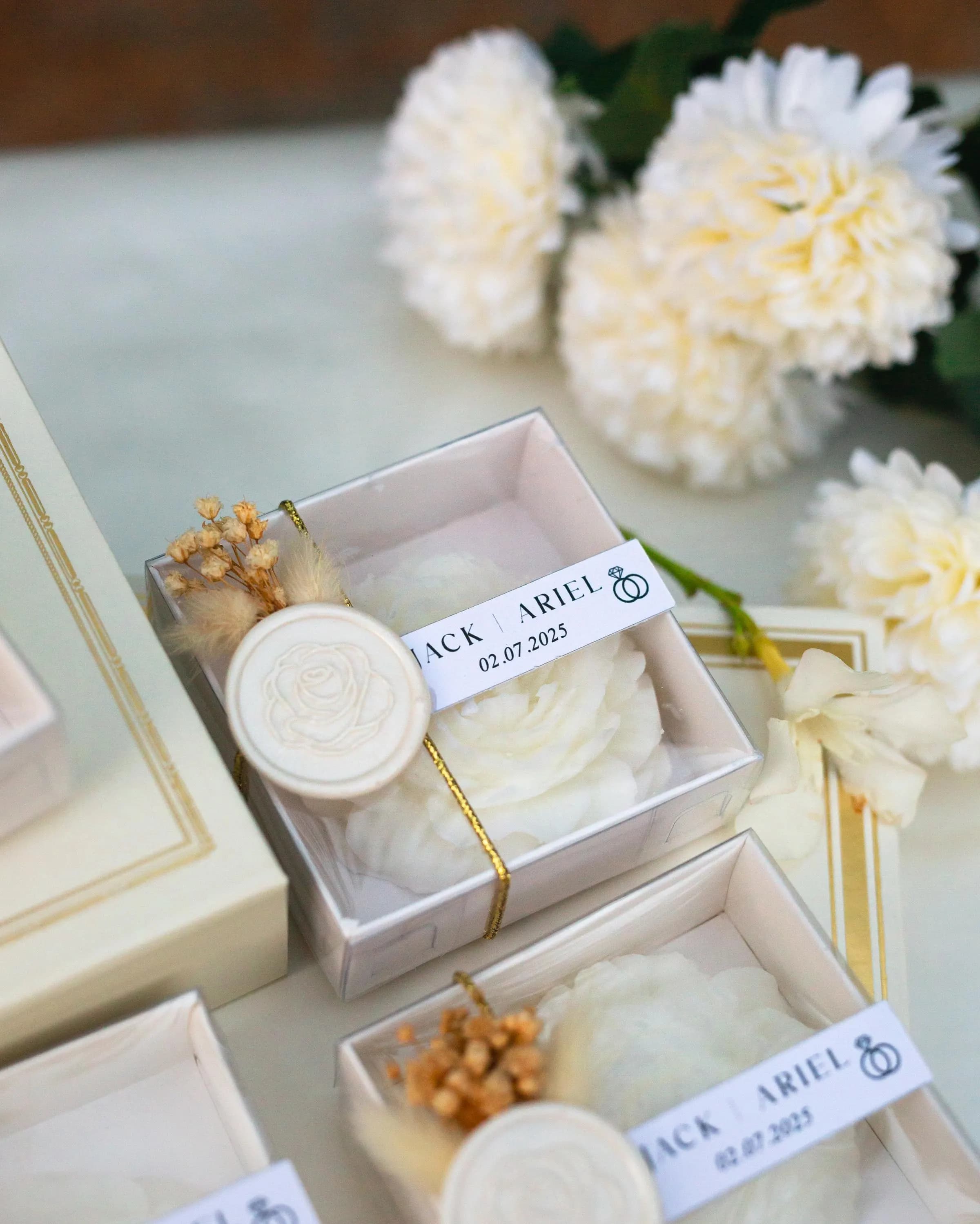 Baby shower candle favor with personalized tag and ribbon