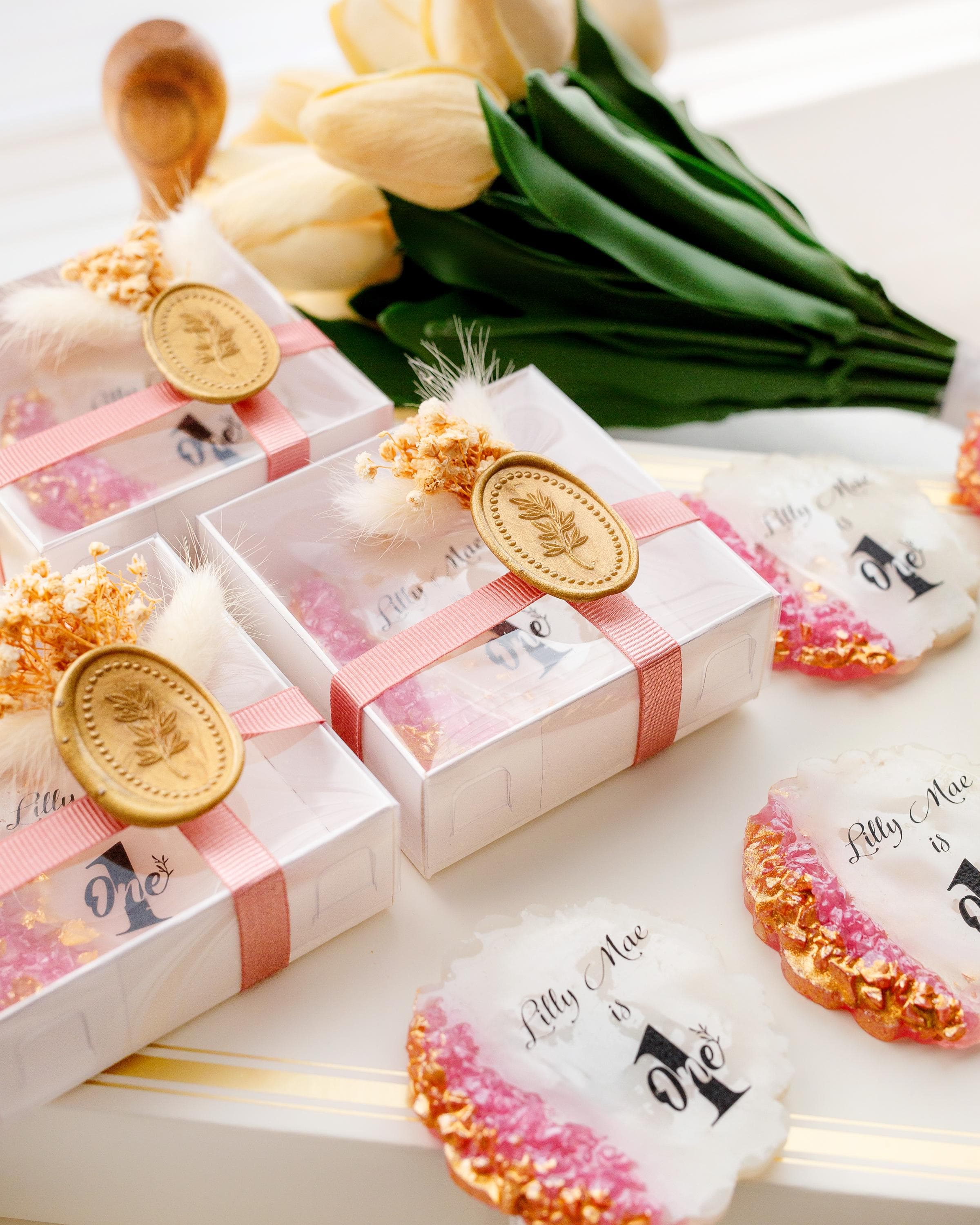 Elegant first birthday party favor with rose gold theme and ribbon