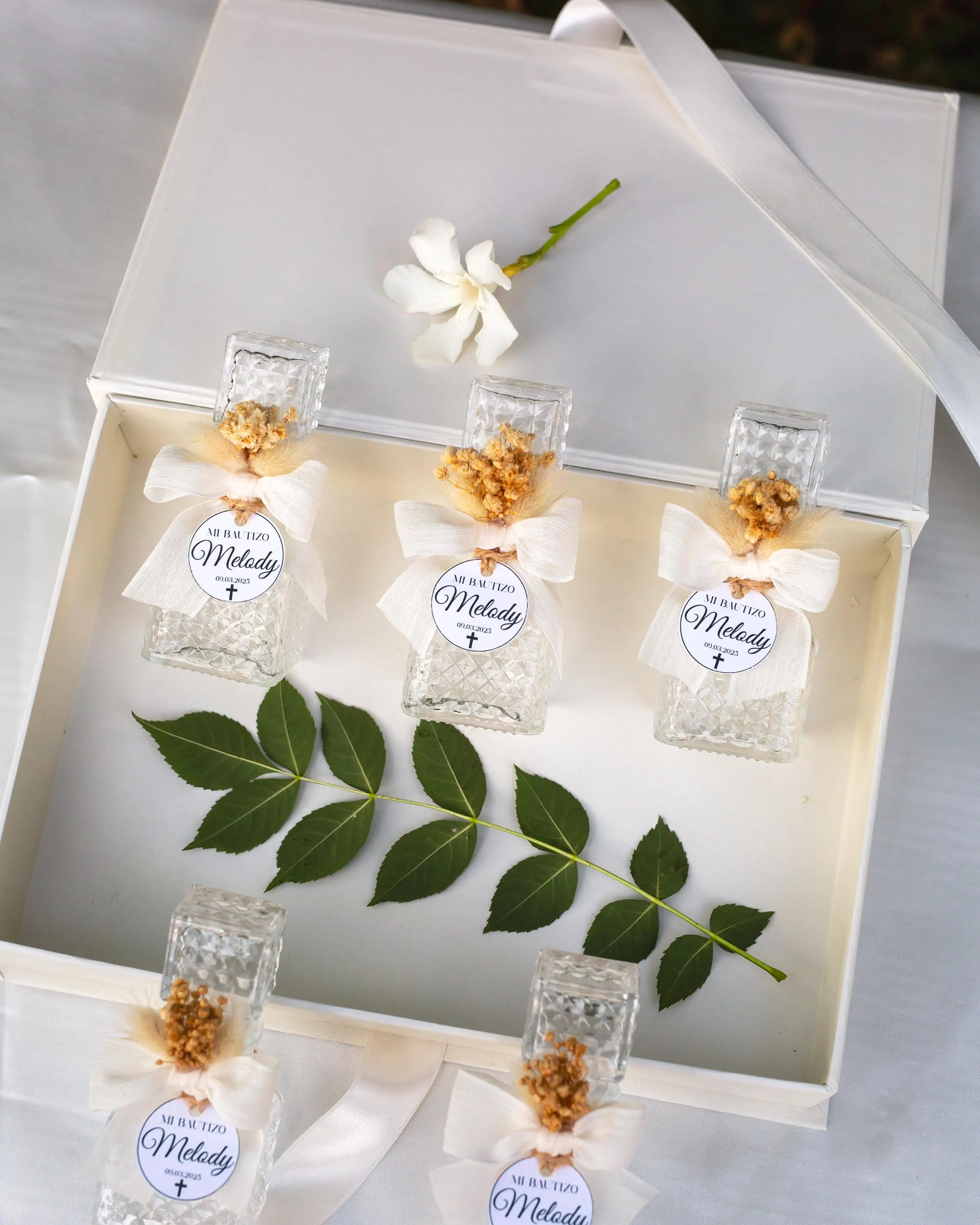 Personalized Mi Bautizo holy water favor bottles for guests
