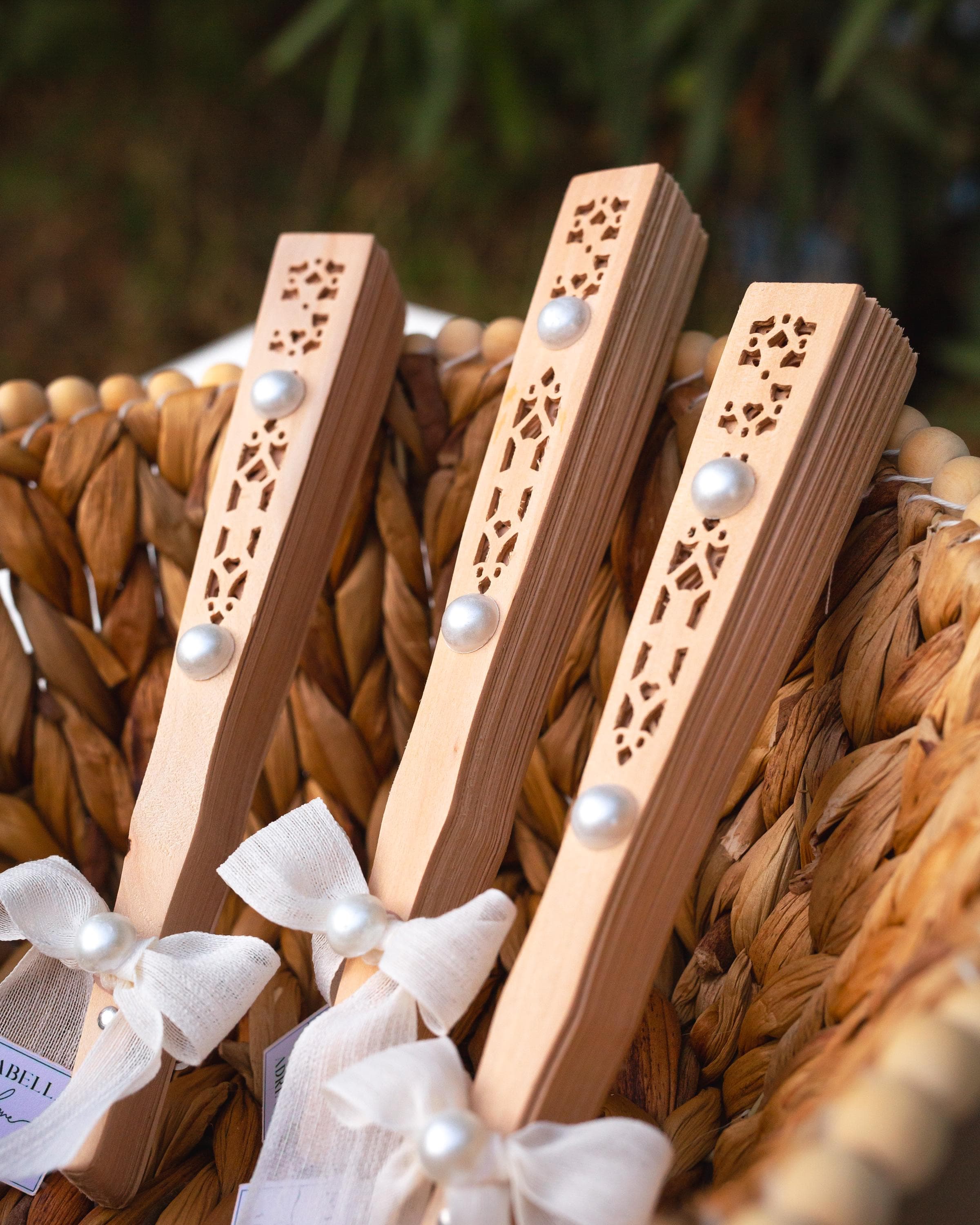 Personalized sandalwood fan with ribbon and custom tag