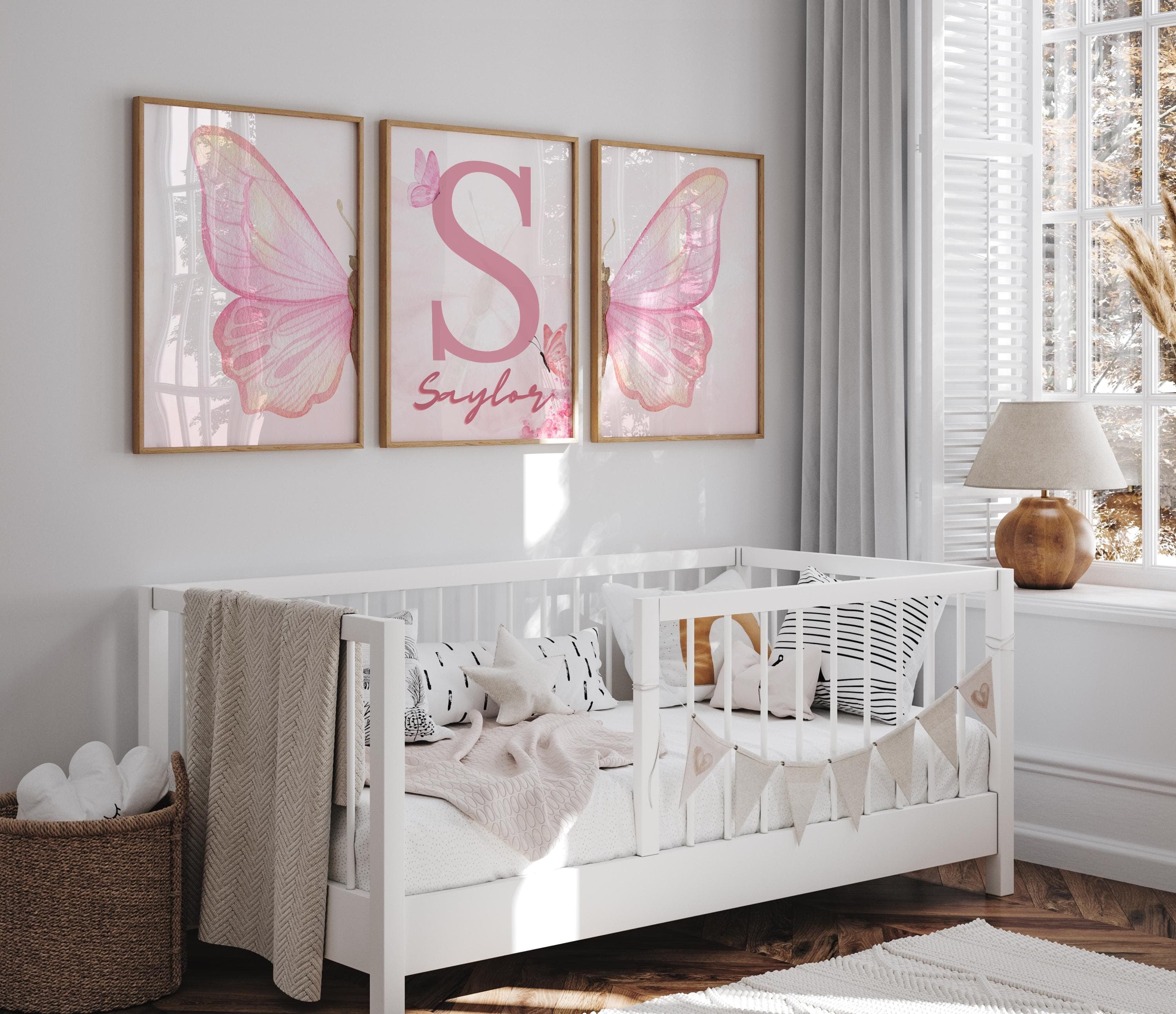 Pink butterfly-themed wall art set for girls' bedrooms or nurseries.