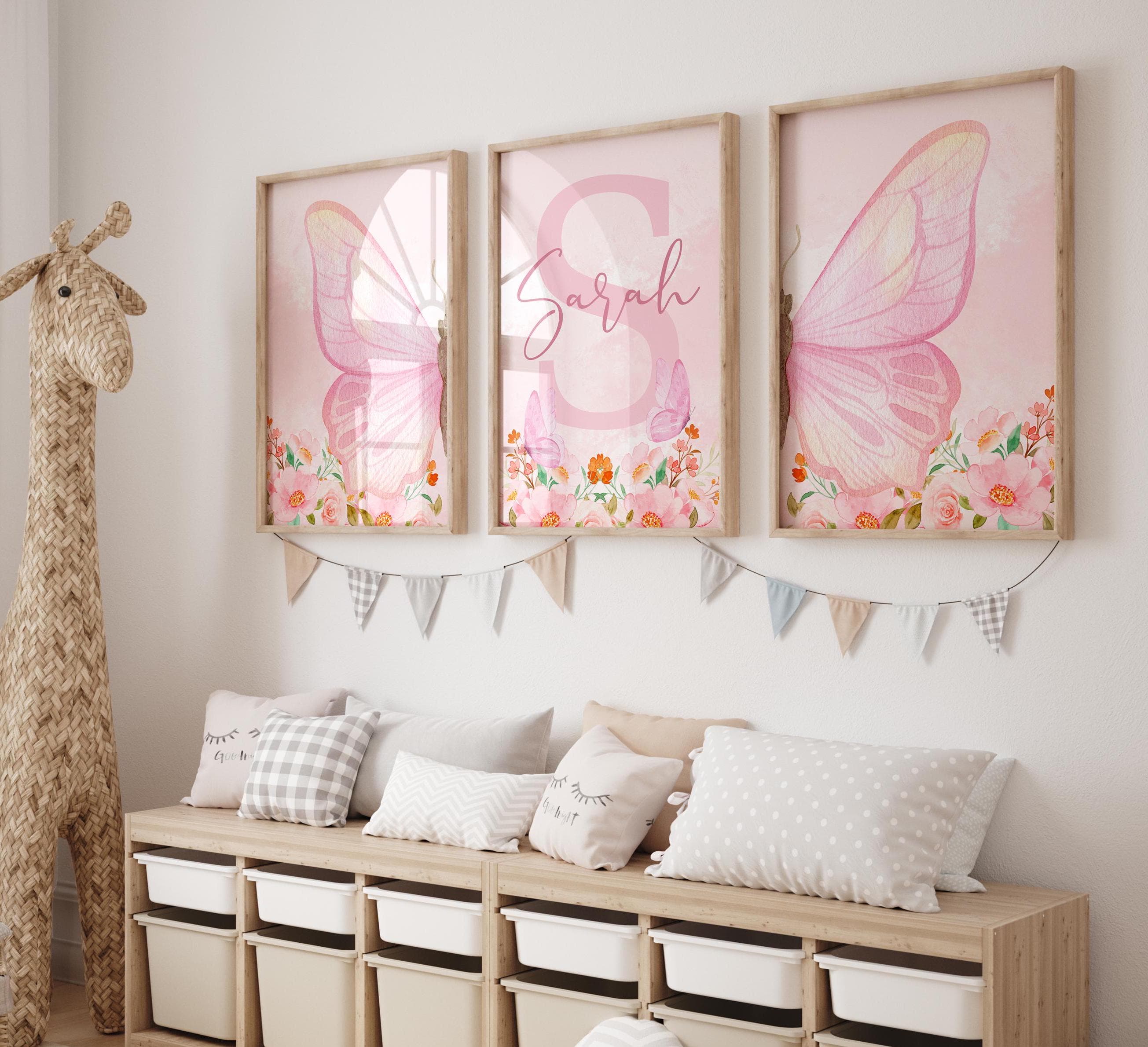 Watercolor pink butterfly wall art with flowers for girls' room.