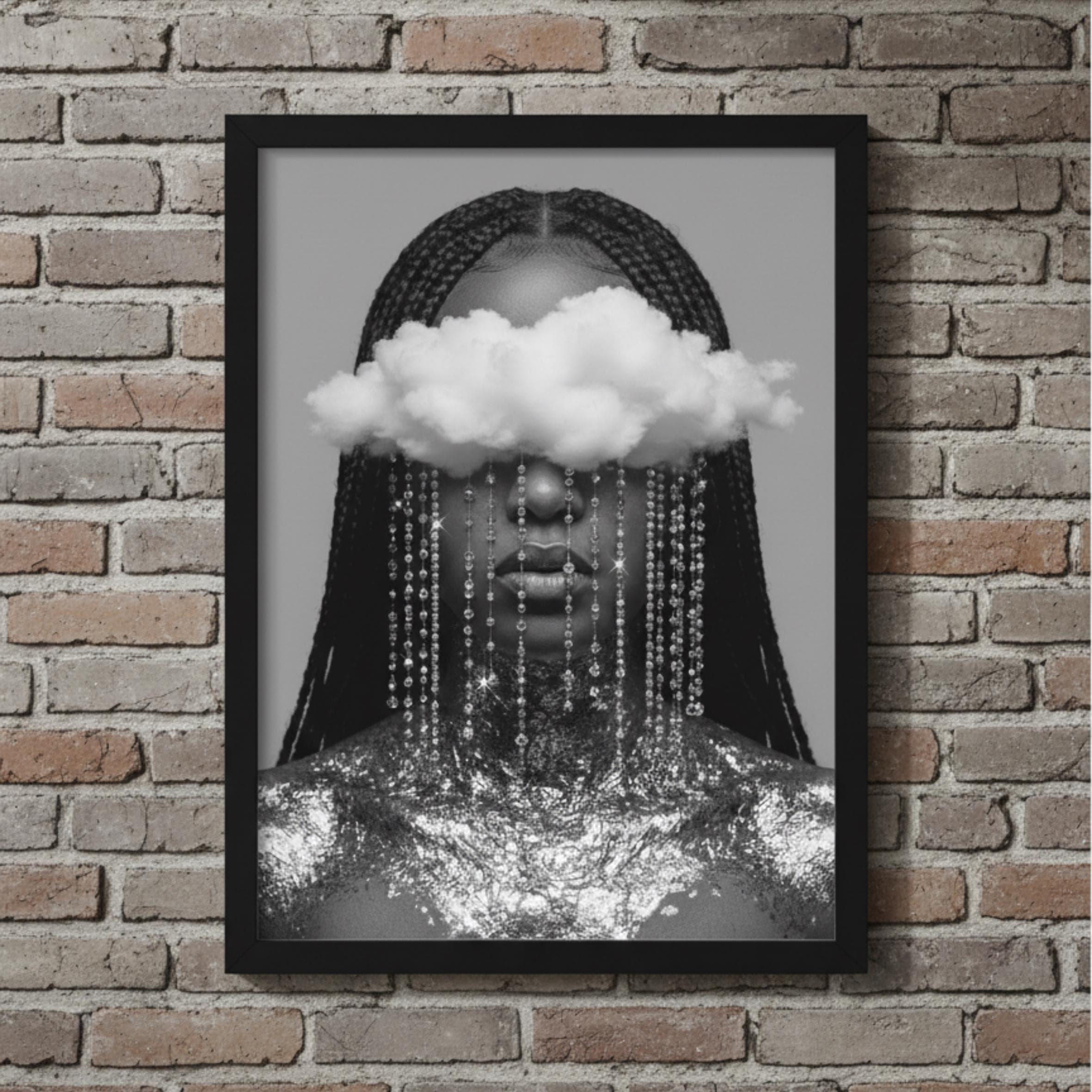 May include: Black and white framed art print featuring a person with long braids, a cloud covering the eyes, and strands of beads cascading down. The person's neck and shoulders are adorned with silver foil.