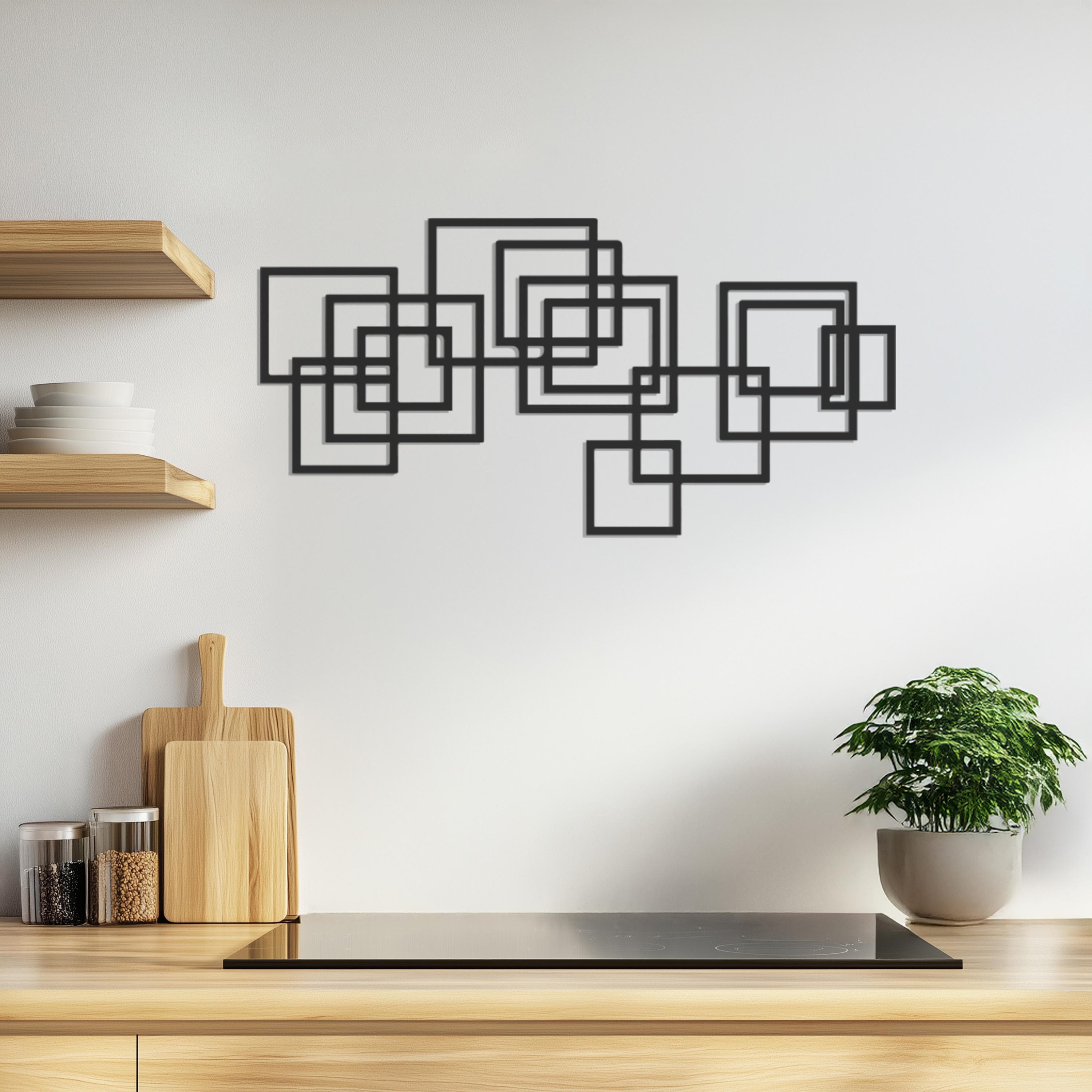 Black geometric wall art with overlapping square designs